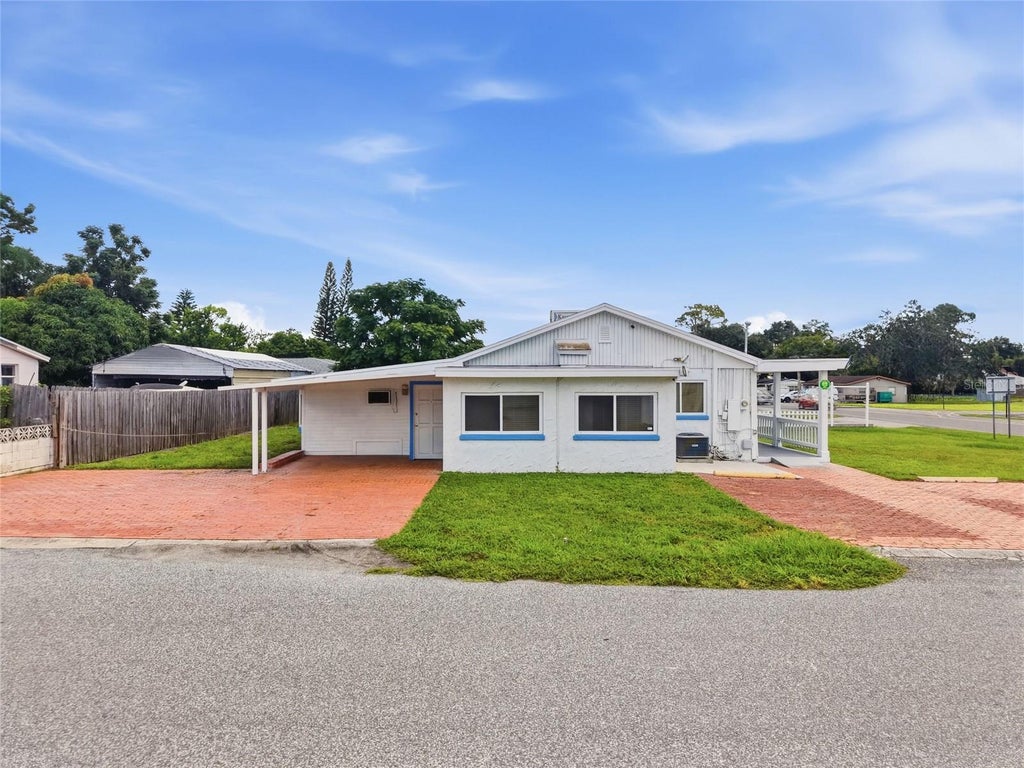 Photo of 4539 Mile Stretch Drive, Holiday, FL 34690 (MLS # TB8545434)