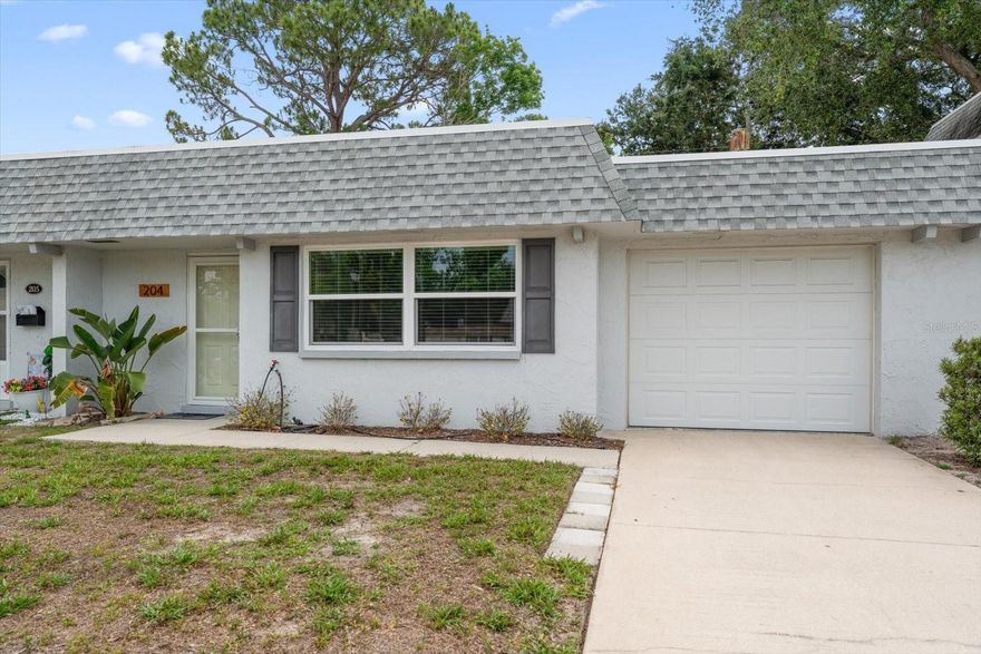 Welcome to the 55+ community of Rothmoor in Largo. This renovated, move-in ready 1-bedroom, 2-bath villa with a 1-car garage blends Scandinavian-inspired modern design with thoughtful upgrades throughout. Features include luxury vinyl plank flooring, oversized wood trim, shiplap accents, fresh interior paint, and all-new Levolor window treatments.

The bright, open living space flows into a beautifully updated kitchen with stainless steel appliances, granite countertops, new cabinetry, and recessed lighting. Both bathrooms have been fully renovated, including a guest bath with raised ceilings, porcelain tile, and a floating vanity.

Additional upgrades include new lighting and ceiling fans, updated exterior fixtures, new door hardware, a Masonite impact-rated garage door, impact-rated front windows and storm door, a new electric panel, and a 50-gallon commercial-grade water heater (2023). New (2023) electrical panel. Association replaced the roof in 2019.

Enjoy a private covered patio and an ideal location just 10 minutes from the Gulf beaches, with easy access to downtown Largo, Belleair Bluffs, local shops, restaurants, the library, and walkable to the Highland Rec Center. Offered partially furnished.
