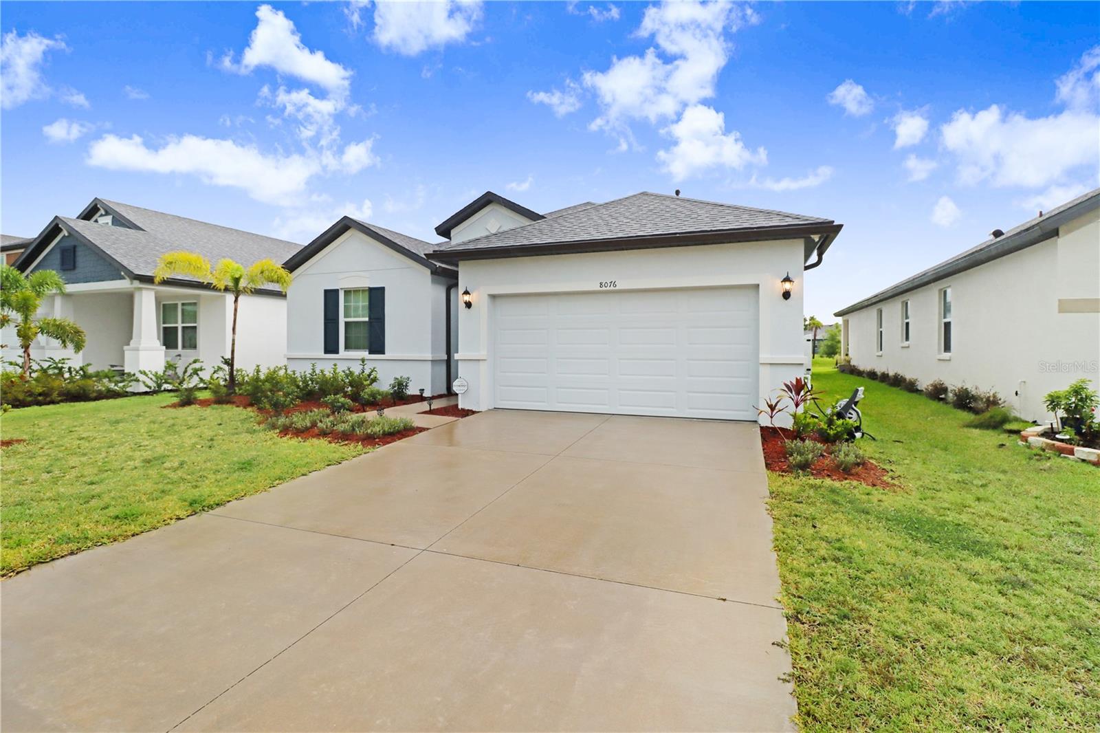 Beautiful and spacious 4-bedroom, 2-bath single-family home for rent in the desirable Imperial Lakes community, located at 8076 Tea Olive Terrace, Palmetto, FL 34221. This nearly 1,900 sq ft one-story home, built in 2024 with durable block and stucco construction, features a modern open-concept floorplan, high ceilings, and plenty of natural light. Enjoy a large great room ideal for relaxing or entertaining, an eat-in kitchen with solid wood cabinets, granite or solid-surface countertops, and a built-in pantry. The split bedroom layout offers privacy, including a spacious primary suite with a walk-in closet and en suite bath. Additional features include an interior laundry room, central air and heating, and a mix of ceramic tile and carpet flooring. The fully fenced backyard boasts custom paver patios and tranquil lake views—perfect for outdoor gatherings. The home also includes a 2-car garage, public water/sewer, and underground utilities. Located in a quiet, well-maintained neighborhood with sidewalks and street lighting, and zoned for top-rated schools: Virgil Mills Elementary, Buffalo Creek Middle, and Palmetto High. Conveniently close to shopping, dining, and major highways.Lease terms: 7-month minimum, unfurnished, pets negotiable, tenant responsible for utilities, and landlord maintains major appliances and structure.