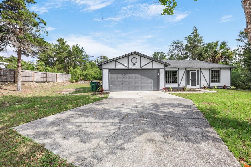 Welcome to your own private retreat! Situated on a rare 1.16-acre lot with NO HOA and zoned A-3, this refreshed home offers the perfect blend of privacy, space, and charm. Tucked away with no neighbors behind or to the right, you’ll enjoy a peaceful setting surrounded by nature while still being conveniently located just 30 minutes from beautiful beaches and approximately 45 minutes to Orlando. Deltona sits at the halfway point between Daytona Beach and Orlando, offering the best of both worlds.

Inside, the home features a spacious split-bedroom floor plan with updated finishes throughout, plenty of natural light, and a cozy wood-burning brick fireplace that creates the perfect focal point in the living area. The oversized primary suite includes a large walk-in closet and double vanity sinks in the bathroom for added comfort and convenience. The refreshed kitchen showcases modern cabinetry, sleek countertops, and stainless steel appliances for a clean, updated feel.

Step outside to the enclosed porch featuring beautiful mosaic-style tile flooring, creating the perfect space to relax or entertain while overlooking the backyard. Major updates include a brand-new HVAC system and water heater, offering peace of mind for the next owner. With room to spread out and enjoy the outdoors, this property offers the privacy and flexibility that’s hard to find.