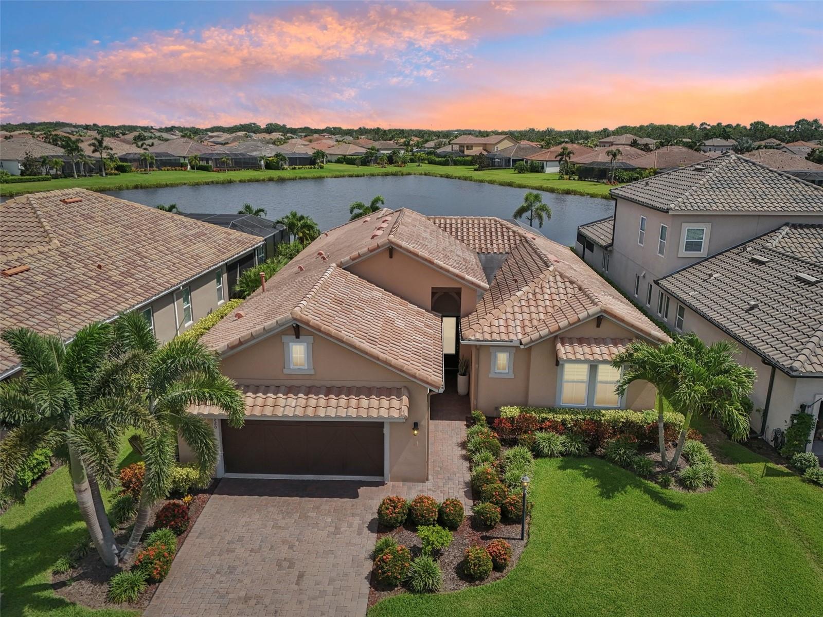 Welcome to your personal slice of paradise in the secure, gated Rosedale golfing community! This stunning custom-built Casey floor plan offers 3 bedrooms, 3 bathrooms, a custom heated pool, and a serene water view—perfectly blending comfort with Florida charm. Built in 2018 in one of the area’s most welcoming, well-kept neighborhoods, this home is filled with thoughtful details that make everyday living feel extra special.
Step outside to your backyard oasis, where enhanced landscaping frames a sparkling pool and screened-in lanai, complete with an outdoor kitchen—perfect for morning coffee or evening get-togethers. Enjoy tranquil water views while relaxing or step directly into the pool for a refreshing dip. Inside, the expansive great room features soaring tray ceilings and an abundance of natural light, effortlessly connecting to the formal dining area and chef’s kitchen.
The kitchen is a showstopper with natural gas, premium appliances, stone countertops, and a dramatic island—ideal for everything from quiet meals to lively gatherings. A spacious laundry room with ample cabinetry adds convenience, and the open layout keeps everyone connected. The peaceful primary suite features custom-designed walk-in closets and a beautifully finished bathroom with a walk-in shower, soaking tub, and double vanity. Guests enjoy their own private suite with a flex/living area, and the third bedroom and bath add even more flexibility.
This home is thoughtfully equipped with hurricane shutters, a wired-for-home generator, a whole-house water softener, commercial-grade gym equipment, and a two-car garage. Located in a non-flood zone with no CDD fees, the low HOA covers lawn maintenance, fiber optic internet/cable, and 24-hour security.
Living in Rosedale means access to incredible amenities: a Jr. Olympic heated pool, lighted Har-Tru tennis courts, a top-notch fitness center, a full-service restaurant and bar, a game room, a vibrant social calendar, and optional golf memberships for the 18-hole championship course. This pet-friendly community also offers dog parks and is close to shopping, dining, UTC Mall, hospitals, downtown Sarasota, world-renowned sandy beaches, Waterside, and I-75.
Schedule a showing today!
Mortgage savings may be available for buyers of this listing.
