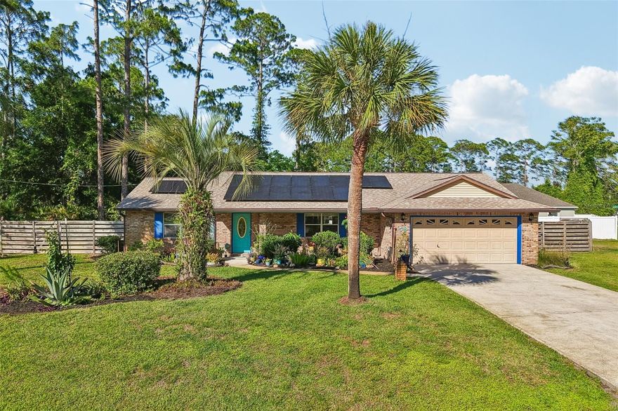 Welcome to the heart of Palm Coast living in the desirable Indian Trails community. This solid brick 3-bedroom, 2-bath home offers over 1,800 square feet of thoughtfully designed living space with a split floor plan that gives everyone room to spread out comfortably.
Step inside to find a warm and inviting living room centered around a cozy fireplace, perfect for relaxing evenings or gathering with family and friends. The kitchen features granite countertops, full appliances, and plenty of space to cook, entertain, and make memories.
Outside, the corner lot provides added privacy and curb appeal, while the fully fenced backyard is ready for pets, play, or your future outdoor oasis, irrigation system on it's own well for that fabolus landscape. A spacious 2-car garage and solar system add both convenience and efficiency to everyday living. As beautiful as the front garden is, the potted plants will not stay-
Located close to schools, shopping, parks, and just a short drive to the beach, this home blends comfort, practicality, and the Florida lifestyle so many are searching for.