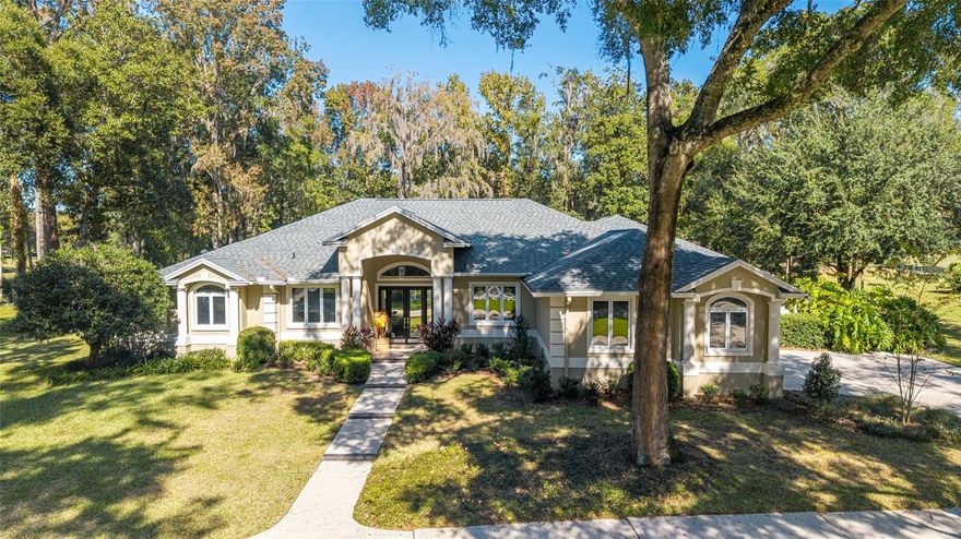 Welcome to this charming 4 bedroom, 3 bath beauty with a 3 car garage located along the 1st fairway in the Country Club of Ocala. This home sits on a full acre with a backyard dotted with gorgeous trees. Inside, you’ll find beautiful hardwood floors throughout all the main living areas. There’s a formal living room with French doors leading out to the pool, a formal dining room and a cozy family room with a wood burning fireplace and sliders that open to the lanai. The kitchen overlooks the family room and features warm wood cabinets and granite countertops. The split bedroom layout gives everyone their own space. Two bedrooms share a full bath, while the fourth bedroom sits near the primary suite and has access to a full bath that also works as the pool bath. The primary bedroom is oversized with room for a sitting area and also has French doors that head right out to the pool. And speaking of the outdoors, you’ll love the screened-in pool, covered lanai and peaceful views of the golf course and mature trees. It’s the perfect spot for morning coffee or afternoon swims. A wonderful home in an unbeatable setting!