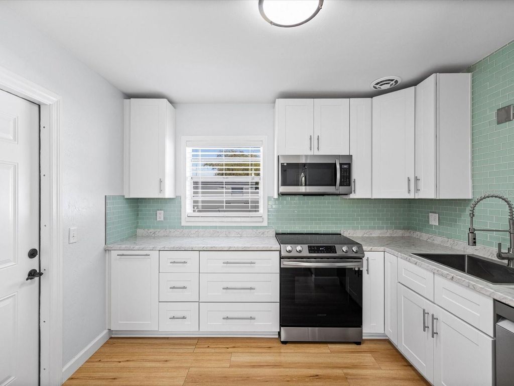 Photo of 530 Lexington Street, Dunedin, FL 34698 (MLS # TB8485766)