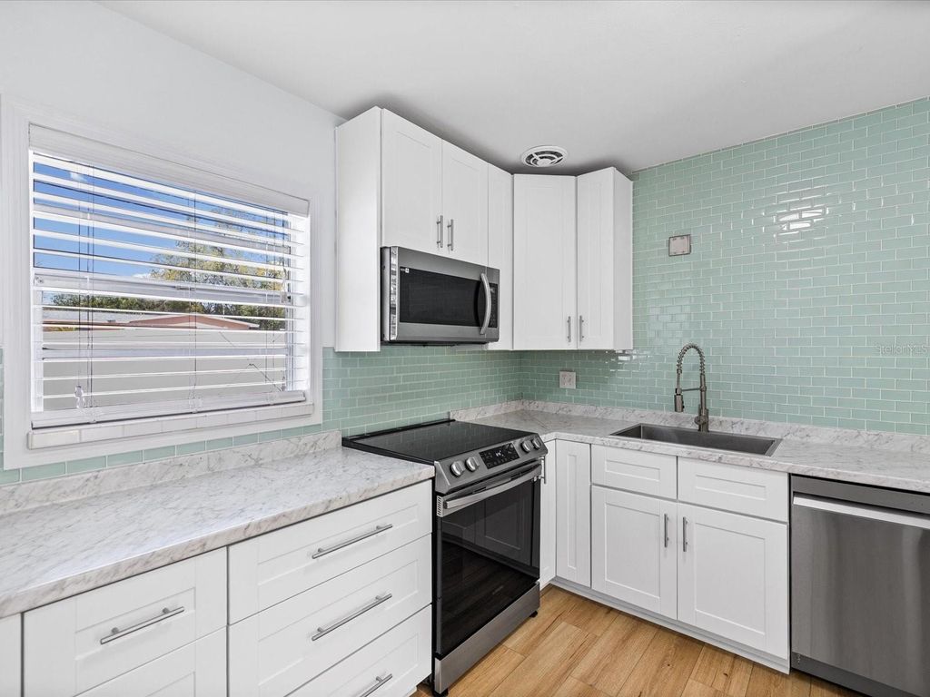 Photo of 530 Lexington Street, Dunedin, FL 34698 (MLS # TB8485766)