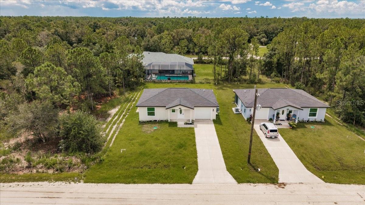 Skip the stress of building and move right into this brand-new 2-bedroom, 1-and-a-half-bathroom home with an attached garage, nestled in the peaceful rural community of Tropical Gulf Acres. Featuring an open-concept layout with a spacious great room, this home offers versatile living and entertaining space. Interior highlights include elegant wood-look luxury vinyl flooring throughout, tray ceilings in both the great room and primary bedroom, stylish light and ceiling fan fixtures, and recessed lighting for a modern touch. The kitchen is a standout with granite countertops, an abundance of shaker style cabinets, stainless steel appliances, a pantry, built-in buffet, and a breakfast bar that flows seamlessly into the great room—perfect for entertaining guests. The primary suite includes a built-in closet and a private full bath with a granite-topped vanity and linen storage. The guest bedroom also features a built-in closet. Additionally, a half bath in the hall adds to the practicality of the home. The property is further complemented by a single-car garage with ample space and a designated laundry area, providing the perfect combination of functionality and convenience. Hurricane impact windows throughout, provide enhanced storm protection, energy efficiency, and peace of mind year-round. Whether you're enjoying a quiet evening on the patio or entertaining friends in the open and inviting living space, this home is a haven of comfort and style. With its modern amenities, quality finishes, and the charm of being a single-owner property, this residence is ready to welcome its next chapter of memories. Located in a quiet, family-oriented neighborhood with no HOA or CDD. Minutes from historic downtown Punta Gorda, Fisherman's Village Restaurants, shopping, waterfront parks, events, and more. Close to I-75 and US-41. Near two airports: Punta Gorda and Southwest Florida International. Tropical Gulf Acres has a country-like feel, yet in a reasonable commute to Port Charlotte, Fort Myers, or Cape Coral.