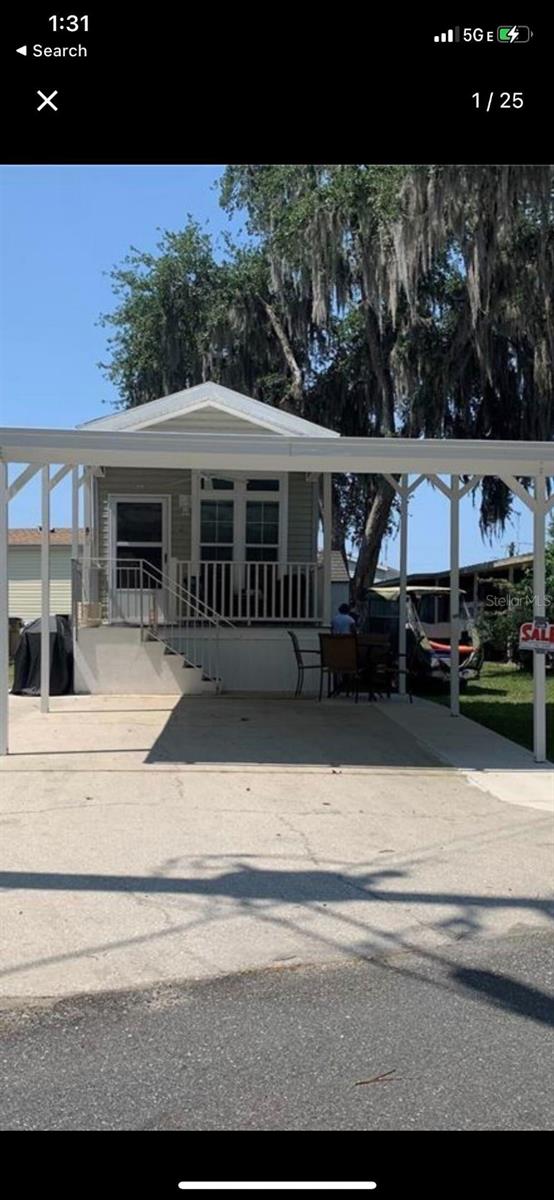 New in 2019, park model manufactured home with all the extras. Includes lot (No Lot Rent). Energy efficient, crown molding, wood cabinets. Waterfront co-op community to the chain of lakes. Beautiful.