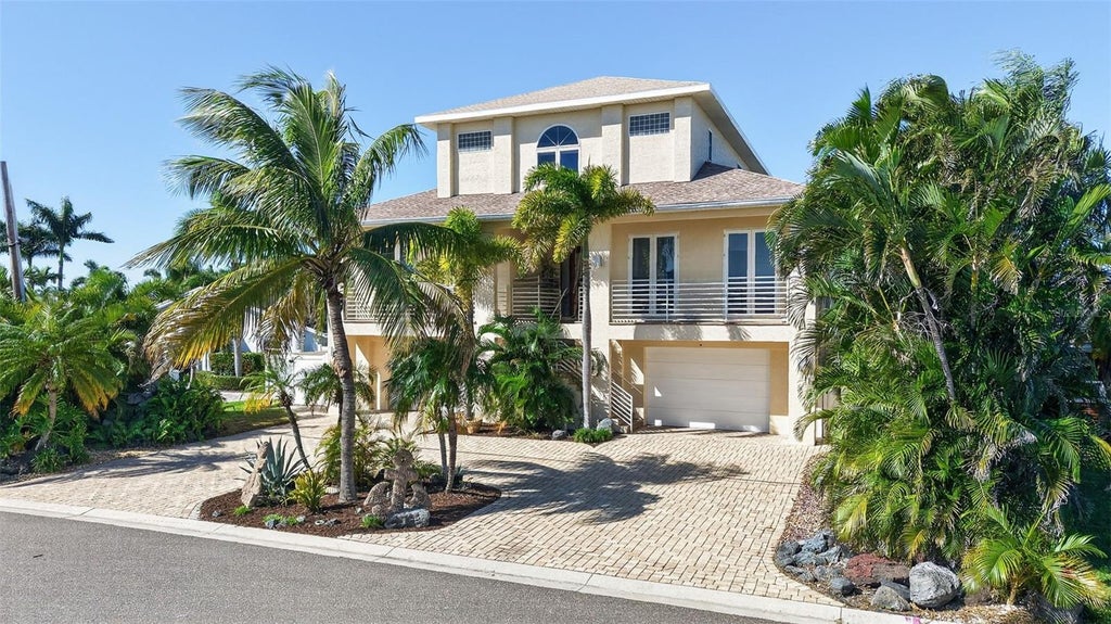 Photo of 532 Johns Pass Avenue, Madeira Beach, FL 33708 (MLS # TB8561081)