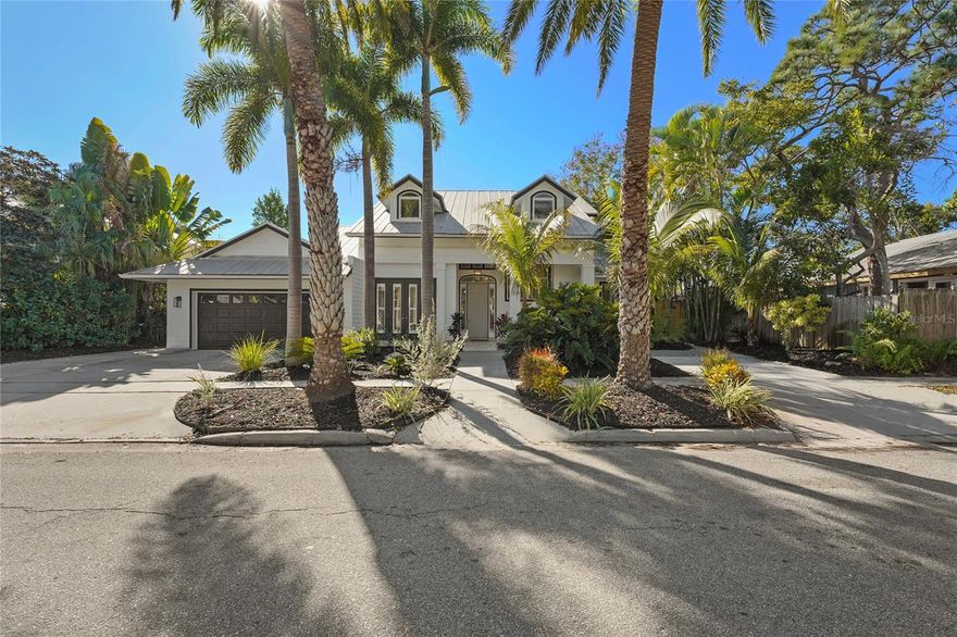 Welcome to this stunning 5-bedroom, 5-bathroom home ideally located near the Hillview District, downtown Sarasota, and just minutes from to Southside Elementary School. Enjoy the best of “West of the Trail” living in this beautifully updated residence that blends timeless architectural charm with modern luxury. The home features a brand-new gourmet kitchen highlighted by a striking double island with quartz waterfall countertops, stainless steel appliances including a gas cooktop and hood, a wine refrigerator, and a custom buffet offering abundant storage. A true formal dining room provides the perfect setting for entertaining. Original travertine tile floors flow throughout the expansive first floor, leading to the primary suite with a large walk-in closet and a spa-inspired ensuite with direct access to the pool deck. The split floor plan also includes a private guest suite with its own ensuite bath. Floor-to-ceiling windows fill the home with natural light and showcase views of the exceptional backyard. Upstairs, you’ll find three additional bedrooms and two fully updated bathrooms. The backyard is truly a rare find—a private oasis featuring a spacious pool, covered lanai, pergola, outdoor shower, storage shed, and full fencing. With its generous size and proximity to downtown, this outdoor space is perfect for relaxing, entertaining, or creating lasting memories. This exceptional home offers comfort, elegance, and an unbeatable location—an opportunity not to be missed.