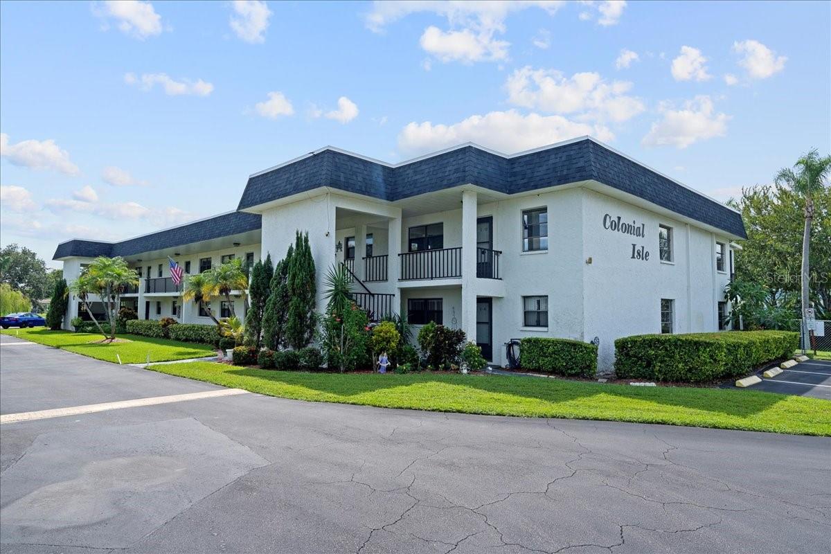 Welcome to this beautifully updated 2-bedroom, 2-bath, second-floor condo offering tranquil pond views from both the front and back of the unit. Located in the maintenance-free 55+ community of Colonial Isles, this home offers the perfect blend of a friendly, relaxing atmosphere and pride-of-ownership charm. The updated kitchen features Corian countertops, stainless-steel appliances, a stylish backsplash, a spacious pantry, and a convenient pass-through breakfast bar to the dining area—perfect for casual meals or entertaining. The open living and dining area highlights beautiful tile flooring and triple glass sliders that open to a peaceful balcony overlooking the pond. This inviting semi-outdoor space is ideal for enjoying gentle breezes, the sounds of nature, or sipping a morning cup of coffee. A second set of glass sliders on the balcony open to reveal screens, allowing fresh air when open or the cool comfort of the A/C when closed. The spacious primary bedroom also enjoys a pond and fountain view and features a walk-in closet along with a bright, updated ensuite bathroom complete with a stylish vanity and modern tile accents. The second bathroom is also updated, and the second bedroom offers a large wall closet. Both bedrooms are finished with luxury vinyl flooring. Additional highlights include an in-unit laundry closet, covered parking with an assigned spot, ample guest parking, and plenty of in-unit storage, including attic access. Colonial Isles is a cozy community of just two buildings and offers a swimming pool, shuffleboard, and a community center with a gathering room and full kitchen. Monthly fees include cable, internet, exterior and grounds maintenance, pool, pest control, insurance, sewer, trash, and water. Centrally located near shopping, dining, medical centers, and just 6 miles from Clearwater Beach and 7 miles to the Clearwater/St. Petersburg International Airport. Don’t miss out —these units seldom come on the market. Schedule your private tour today!