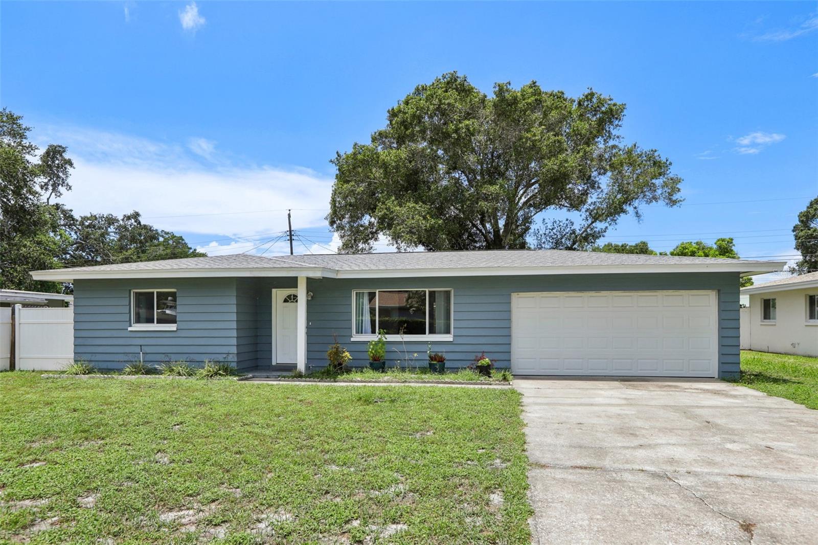 Located in sunny Largo is this 2 bedrooms, 2 baths, 2 car garage lovingly maintained concrete block home with a large fenced backyard. Enjoy living in this home offering an updated kitchen with stainless steel appliances, wood cabinets and granite countertops. You will also find updated bathrooms, an open floor plan and ceramic tile flooring throughout. In the spacious, fenced backyard, you will find a covered patio for sitting and relaxing in the shade. There is a 2022 roof, double pane windows, 2021 HVAC, and 2021 hot water tank. It is NOT LOCATED IN A FLOOD ZONE, so flood insurance is NOT required, and it did NOT sustain damage from either Hurricane Helene or Milton. This friendly neighborhood is located close to schools, Taylor Park, Pinellas Trail, BEACHES, public boat ramp, public golf courses, shopping, medical facilities, and restaurants. This is a great opportunity to make this sweet home yours.