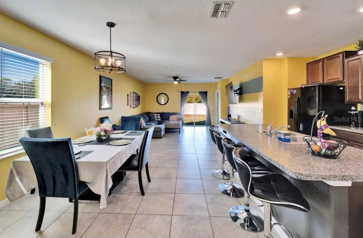 Short-term rental. Spacious 5BD/2.5BA home in the desirable Vista Palms community! Features include an open floor plan, modern kitchen, first-floor primary suite, upstairs loft, 2-car garage, and in-unit laundry. Perfect for families or anyone needing extra room to work, relax, or entertain. The primary suite is located on the main level and includes a walk-in closet and en-suite bath. Upstairs, you’ll find four additional bedrooms and a full bathroom. The home also includes a 2-car garage and a laundry room with washer and dryer.