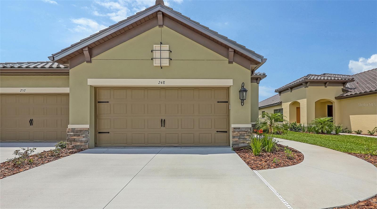 The Tidewater 2 two-bedroom, two-bath twin villa home designed by Neal Communities features a spacious layout with an open living area. The home includes an open great room, dining area and beautifully-equipped kitchen with island for enjoying five-star meals. A den offers the perfect space for a home office, while a covered lanai at the back of the home provides a lovely environment for enjoying the outdoors. The Master suite features two closets and a bath with dual sink vanities, walk-in shower and private water closet. A walk-in closet and proximity to a full bath makes the second bedroom a great guest room.