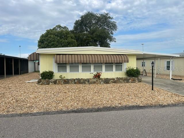 * New on Market*Welcome to 6735 Kensington Dr NE, Winter Haven, a very well-maintained 2-bedroom, 2-bathroom manufactured home in the desirable 55+ community of Lake ‘n Golf Estates, where you OWN your lot—no lot rent! New roof installed (2021) Upgraded appliances and home semi- furnished. . The spacious primary suite is featuring an ensuite bathroom and plenty of closet space. There is an additional guest bedroom and guest bathroom plus a dedicated inside laundry room and an inviting front porch perfect for enjoying the peaceful surroundings. The large driveway and carport are providing plenty of parking spaces.. Residents of Lake ‘n Golf Estates enjoy an annual HOA fee of just $550, granting access to a clubhouse, heated pool, boat ramp, and dock, perfect for those who love an active and social lifestyle. With its ideal location, well-kept condition, and the added benefit of no lot rent, this property is a fantastic opportunity for those seeking affordability, comfort, and a welcoming 55+ community. Priced to Sell! Please schedule your showing today!