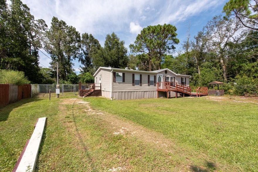Short Sale. APPROVED SHORT SALE!! Do not miss out on this amazing opportunity! 
Experience peaceful Florida living in this charming 3-bedroom, 2-bath home set on a serene half-acre lot surrounded by lush greenery. With no HOA or CDD, you’ll enjoy the freedom to live the lifestyle you love. Inside, the split-floor plan offers an inviting open living space, a comfortable dinette, and an eat-in kitchen with updated appliances. The primary suite features a spacious closet and a relaxing ensuite with double vanities, a whirlpool tub, and a walk-in shower. A dedicated laundry room adds convenience, and select furnishings are included. The home operates on well and septic and comes equipped with a new water softener system. Located near golf courses, distilleries, and local dining, this property is your gateway to the natural beauty and charm of Homosassa.