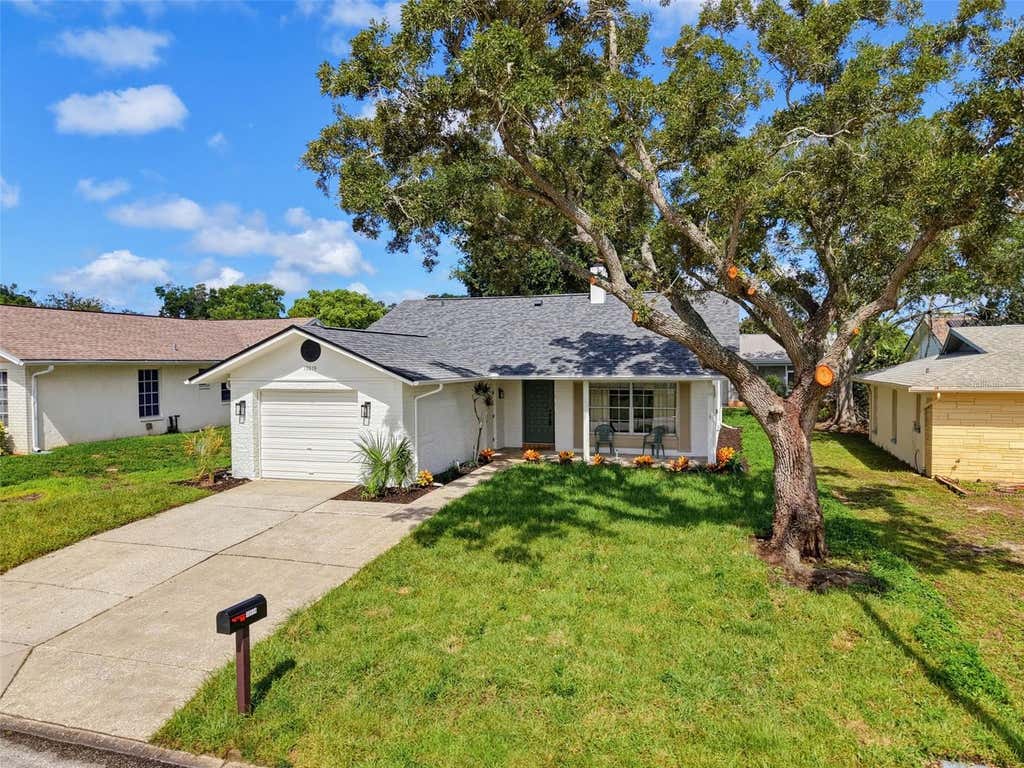 Photo of 10819 Los Santos Dr, Port Richey, FL 34668 (MLS # W7888378)