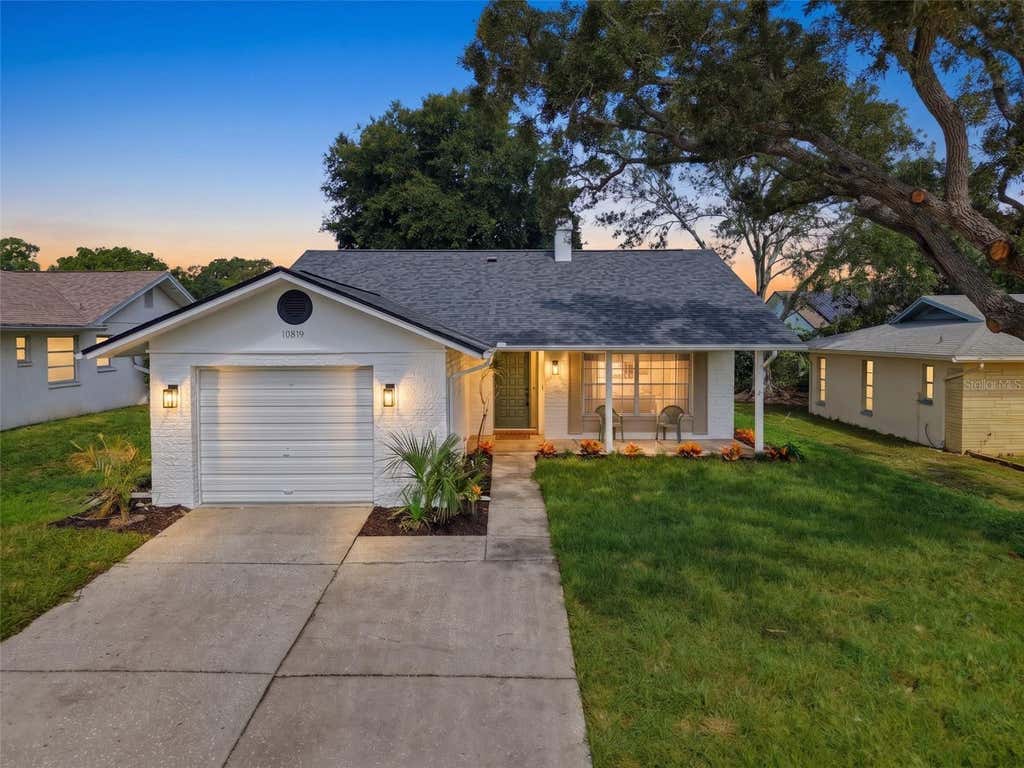 Photo of 10819 Los Santos Dr, Port Richey, FL 34668 (MLS # W7888378)