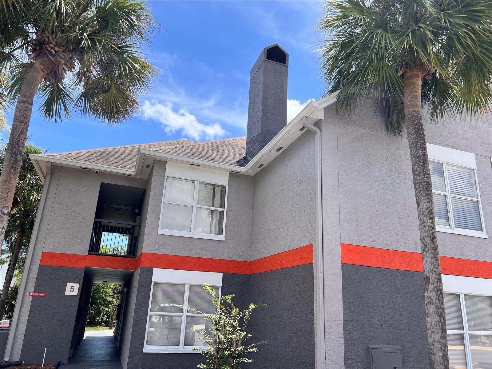 INVESTOR ALERT - 1 bedroom/1 bath condominium located just 1.5 miles from Walt Disney World at The Parkway Palms Resort. Located across from Celebration and minutes from numerous dining, shopping and entertainment establishments with easy access to major highways. This oversized 2nd floor unit offers a separate kitchen area including pantry, decorative fireplace in living room with a sofa sleeper, king size bedroom with closet all at a prime location in Building 5 offering access to pool and parking. The turn-key unit is has been renovated and tastefully decorated. The COA fee includes electric, cable, internet, water, exterior building, roof and maintenance of all common areas. AIRBNB currently as it is a perfect rental investment along with relaxing and enjoying your unit while on vacation in the Orlando area. Guests will enjoy the pool, jacuzzi, gazebo with grills, fitness center, basketball, sun deck and laundry facilities.