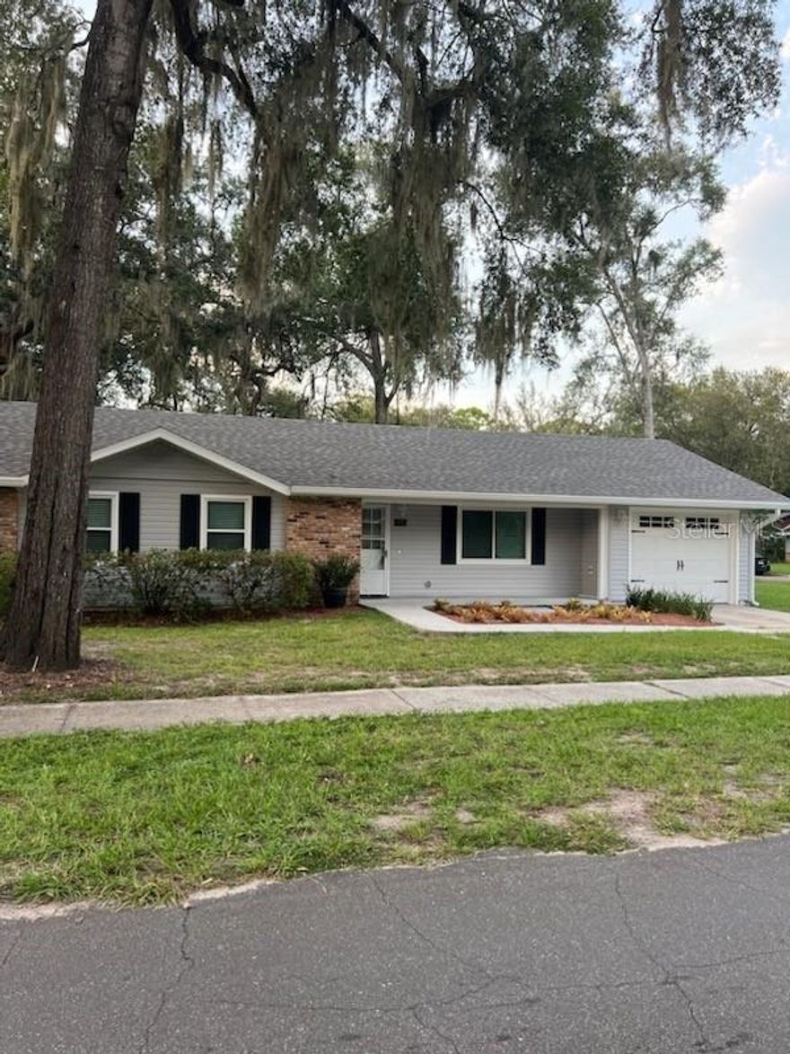 Welcome Home to this Beautiful 3 Bedroom 2 Bath home in Mount Dora, someplace special. Renovated completely and with great care. The kitchen is a masterpiece and focal point with new stainless steel appliances including wine fridge and granite counter tops. Newer windows through out the home. Bedrooms have great closet space and master bath is huge with new vanity and large shower. 2nd bathroom is also renovated with new tile and vanity. Large open floor plan and rear patio. Vinyl privacy fence in the backyard. Perfect picket fence in the front yard with a covered front porch and less than 1 mile walk to downtown Mount Dora! Newer AC to keep you warm in the Florida winter and ....cool and comfortable this summer and washer and dryer hook-ups in the garage. This is a top notch home in one of the very best towns in Florida.