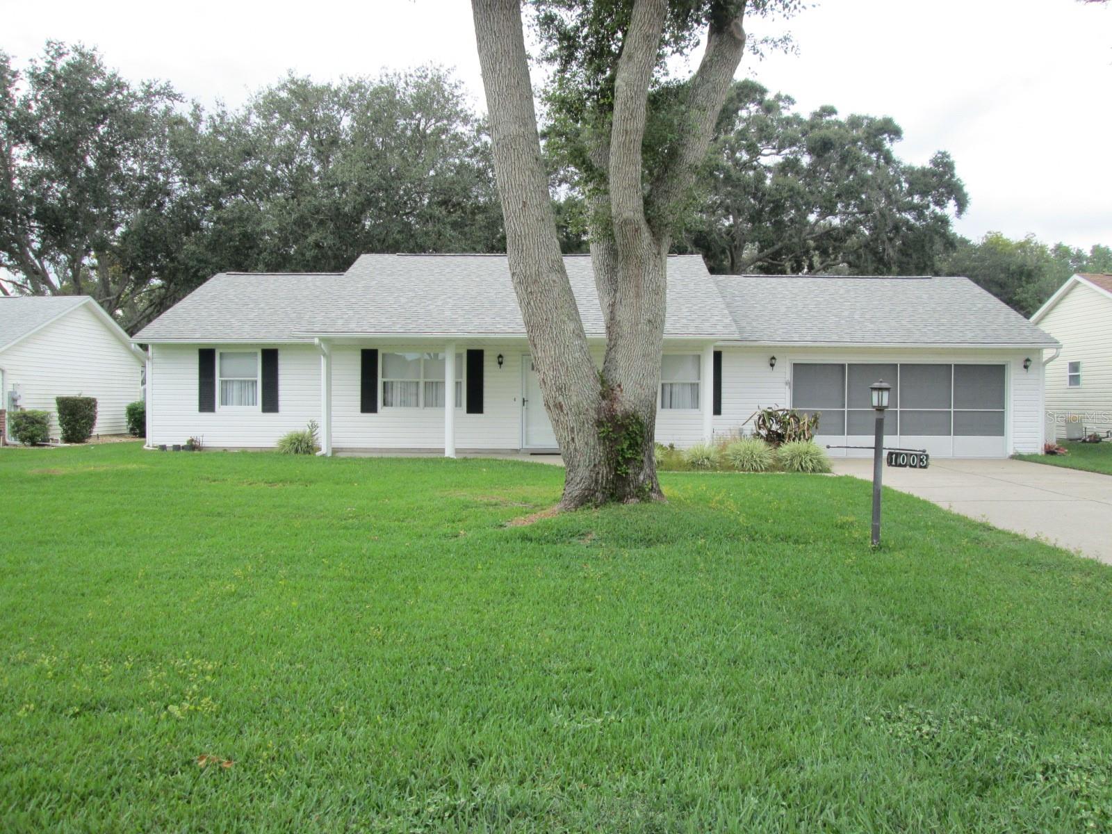 SCOTTISH HIGHLANDS.  WELCOME TO THIS IMMACULATE 2 BEDROOM/2BATH SPLIT PLAN WELLINGTON II MODEL WITH ADDITIONAL DEN AND FLORIDA ROOM FULLY FURNISHED.  2017 ROOF.  WELL FOR IRRIGATION.  2 CAR OVERSIZED GARAGE WITH SCREENED DOOR AND BACK ENTRANCE.  ** Enjoy the spacious cathedral ceilings that create an open feeling in the living room, dining room and kitchen.  Laminate flooring in hallways, living room, dinette, kitchen and dining room.  **Kitchen is large with pass-thru, loads of cabinets, updated countertops, dual sinks, gas stove, closet pantry and rear door to Florida room.  **Primary bedroom is large and has en-suite updated bath with walk-in shower, vanity and newer toilet.  Large 11 x 6 walk-in closet.  ** Guest side of home features a comfortable bedroom with easy access to full bath with tub/shower.   ** French doors lead you into a den/extra bedroom area with an additional Florida Room with river rock flooring.  Outside patio great for grilling.   Long driveway with lovely yard, gutters, solar tube.  ** Great convenient location just a few minute walk to clubhouse, indoor pool, spa, outdoor pool and much more.  Storage for your RV/Boat available.  MAKE THIS LOVELY HOME YOUR NEW ADDRESS AND ENJOY AND THE COMFORTS OF YOUR NEW FLORIDA HOME.