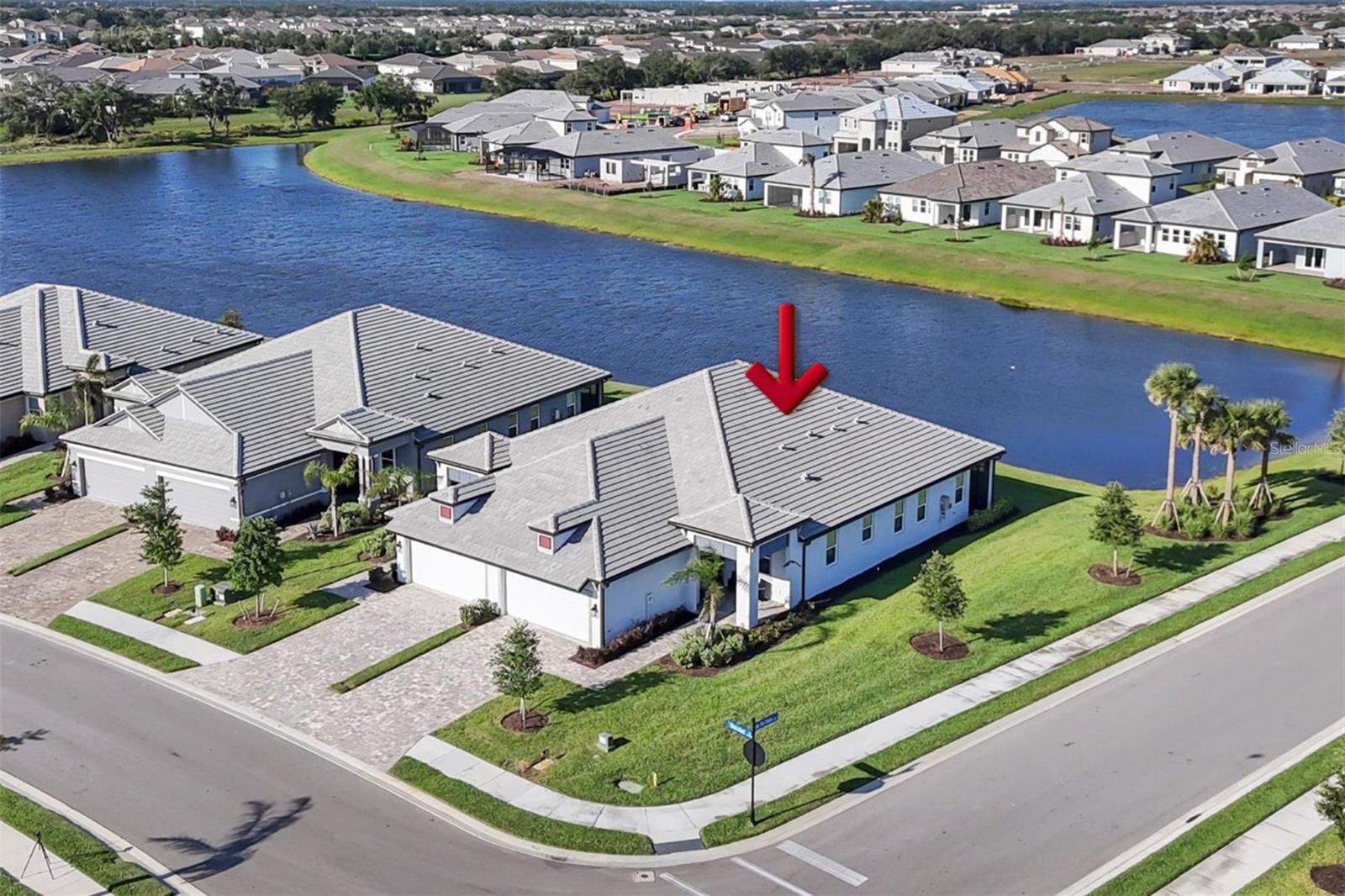 What’s Special
- Lake front view
- High-end upgrades
- Quartz countertops and beautiful cabinetry
- Impact-rated windows
- Thoughtfully designed living space
- Premium lot. Waterfront Villa in Premier Sweetwater Community
Lakewood Ranch, Florida, is the #1 Multigenerational Community in the US
Discover elevated living in this stunning 3-bedroom, 2-bathroom villa featuring 1,672 square feet of designer-enhanced living space on a premium corner lot.
Unparalleled Location & Views
Step through the front door and be greeted by tranquil water views that flow seamlessly from the entrance through the living room to the master suite. This exceptional corner lot position provides panoramic vistas of beautifully landscaped grounds and dual lake views, offering serene natural beauty instead of neighboring walls.
Exceptional Design & Construction
Built by renowned M/I Homes, this modern villa showcases an open, spacious layout enhanced with thoughtful designer upgrades throughout. Impact-rated windows offer year-round hurricane protection and superior energy efficiency, eliminating the need for shutters and providing both peace of mind and reduced utility costs.
Designer Interior Features
Sophisticated Flooring, Featuring Premium vinyl plank flooring, graces the owner's bedroom, living areas, and kitchen, while elegant tile enhances the bathrooms and laundry room, combining modern aesthetics with lasting durability.
Gourmet Kitchen The heart of the home features a bright, spacious design with beautiful cabinetry, upgraded black hardware, stunning quartz countertops, and a contemporary backsplash. The chef-inspired kitchen includes a 5-burner stainless steel gas range with a double oven, perfect for culinary enthusiasts.
Architectural Excellence Enhanced 8-foot doors, sophisticated tray ceilings in both the living room and master suite, and updated modern light fixtures create an atmosphere of refined elegance throughout.
Luxurious Master Retreat: The owner's suite features a spa-like bathroom with quartz countertops, a frameless shower with upgraded black hardware, and a spacious walk-in closet.
Flexible Living Spaces Two additional bedrooms provide versatility as guest accommodations or home offices, each thoughtfully designed with ample closet storage.
Outdoor Living & Entertaining The spacious lanai, accessible through sliding glass doors, provides the perfect setting for morning coffee or evening gatherings, offering peaceful water views.
Premium Amenities & Conveniences
• Impact-rated sliding glass doors
• Quartz countertops in all bathrooms and laundry
• Beautiful custom cabinetry in laundry room
• Epoxy-coated garage floor
• Complete appliance package including washer, dryer, and refrigerator
• Energy-efficient Rinnai tankless water heater
Unbeatable Location
Minutes from UTC shopping, Waterside Place, pristine Gulf Coast beaches, top-rated schools, and vibrant downtown Sarasota. This move-in-ready home represents the pinnacle of quality, lifestyle, and convenience in Florida's most desirable community for multigenerational living.
Experience the Sweetwater lifestyle—where luxury meets tranquility in the heart of Lakewood Ranch.