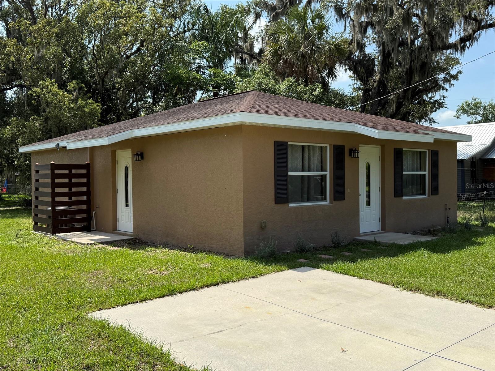 This charming 2-bedroom, 2-bath concrete block home is perfect for first-time buyers or investors. Located on a desirable corner lot, it offers ample outdoor space and privacy. Inside, enjoy the modern tile floors that add a touch of elegance and are easy to maintain. The open concept layout creates a spacious feel, ideal for entertaining! With its prime location and solid construction, this property is a fantastic opportunity for anyone looking to make a smart investment or start their homeownership journey. Don't miss out on this gem!