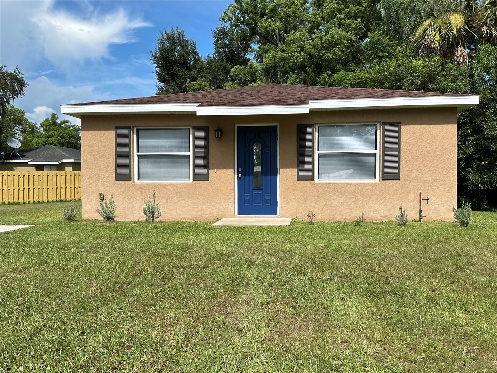This charming 2-bedroom, 2-bath concrete block home is perfect for first-time buyers or investors. Located on a desirable corner lot, it offers ample outdoor space and privacy. Inside, enjoy the modern tile floors that add a touch of elegance and are easy to maintain, fresh interior paint and a brand new appliance package! The open concept layout creates a spacious feel, ideal for entertaining! With its prime location and solid construction, this property is a fantastic opportunity for anyone looking to make a smart investment or start their homeownership journey. Don't miss out on this gem!