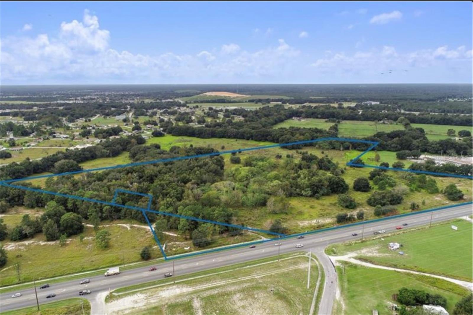 Muti-use site . 60.34 acres approved and entitled for468 apartment units, 180 town homes and 13.5 acres commercial on the front of the road. 1,200' +/- FT of Hwy Frontage on Maricamp Rd, Less than 1.5 miles from Publix, Walmart, Winn Dixie, CVS, Walgreens and next to the post office.