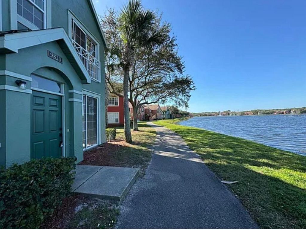 Photo of 9820 Lake Chase Island Way #9820, Tampa, FL 33626 (MLS # TB8471251)