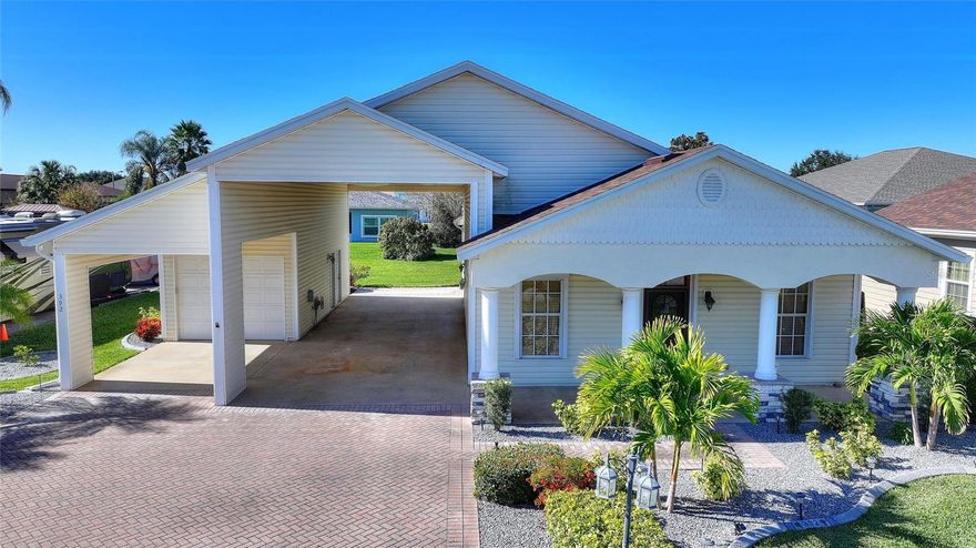 Beautifully renovated and fully furnished home located in the desirable Mt Olive Shores North 55+ motorhome community. This move-in ready property features a spacious 51" X 16' RV port, along with a carport and garage for ample parking and storage. Recent updates include a new roof (2023-24), new flooring (2024) and undated landscaping and curbing (2-24). The air conditioner is approximately 5-6 yrs old, and the home also offers a well for irrigation. The laundry room/storage room is attached to the garage. Bring your clothes and move right in. Come see this beautiful home and enjoy the Florida lifestyle at its best.