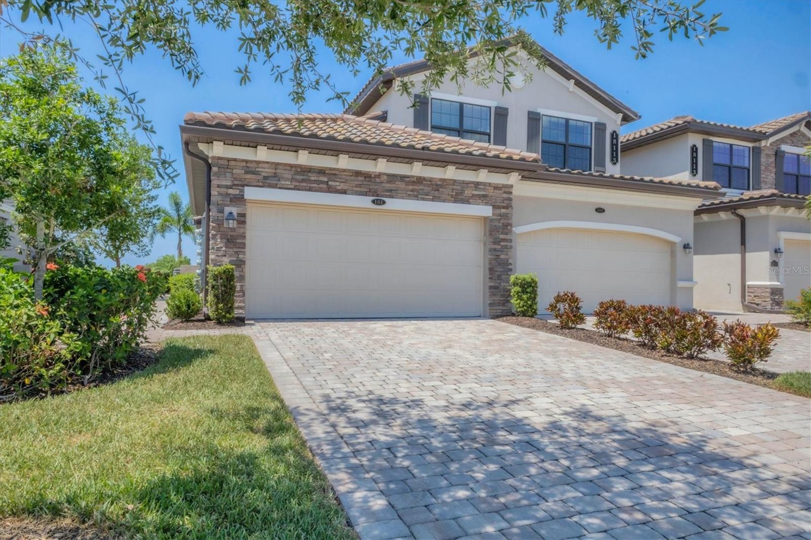 ***NEW PRICE ADJUSTMENT*** WHY WAIT? LIVE LIFE NOW! AMENITIES GALORE in this gorgeous TURNKEY, FULLY FURNISHED Coach Home is situated on Hole 11th of the Piper Course, one of the TWO Arnold Palmer designed Championship Golf Courses in Lakewood National Golf Club situated in the award-winning master planned community of Lakewood Ranch. This ground floor 3-bedroom 2-bath open concept floor plan is immaculate, in like-new condition and has been upgraded throughout boasting beautiful white quartz countertops, custom shiplap millwork, crown molding, designer fixtures and tastefully decorated in an elegant coastal theme. The substantial master bedroom has 2 large walk-in closets, an oversized ensuite bathroom with dual his and her vanities, a large frameless glass walk-in shower and separate water closet. The two guest bedrooms are located at the opposite end and can be closed off for privacy. The kitchen has an oversized center island for entertaining, a large pantry and abundant cabinets for storage. A large fully screened-in lanai overlooks the breathtaking view of this world class golf course! The laundry room has full size washer/dryer, tankless gas water heater and attached 2-car garage. There is a satellite pool steps away. The home has a touchless keypad entry door lock and wired Ring Doorbell. Lakewood National Golf Course has an impressive 24/7 guarded-gate entrance. Residents enjoy a luxury lifestyle with full membership to all amenities including full membership to the 36-hole golf course. Resort-style amenities include a magnificent new Grand Clubhouse featuring 2 restaurants, state-of-the-art fitness center, lighted Har-Tru clay tennis courts with an additional dedicated court with a practice ball retrieving system, pickleball courts, Har-Tru bocce courts, beach entry lagoon pool, casual poolside dining, full-service salon/spa, golf and tennis pro shop with full-time onsite Fitness Director and TPI Certified Personal Trainer. Lakewood Ranch is one of the most desirable locations in the region with easy access to I-75, high-end retail shops at University Town Center, 5-star dining, entertainment, cultural attractions, endless bike trails and parks, world-class beaches and international airports 35 minutes away. Seize the opportunity to own a piece of paradise in this vibrant and welcoming community. Paradise found!