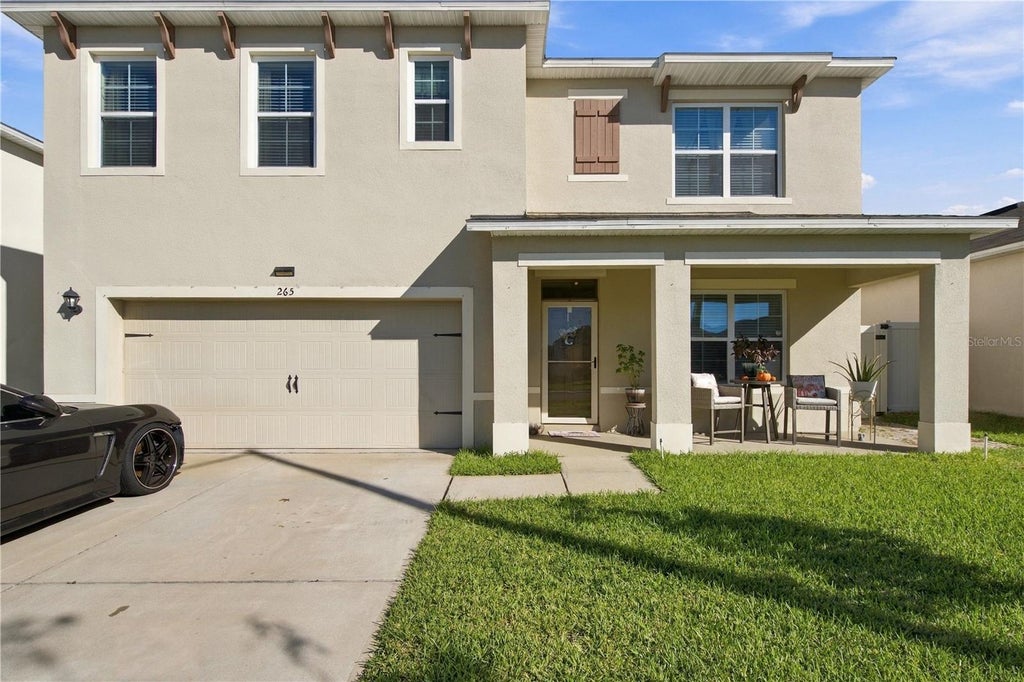 Photo of 265 Ludisia Loop, Davenport, FL 33837 (MLS # S5160463)