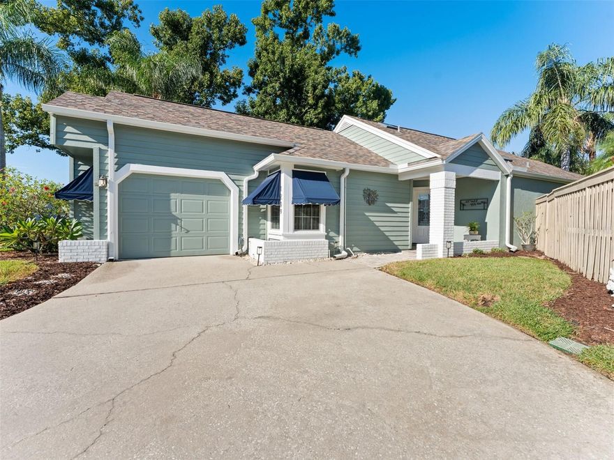 Nestled in the much-desired Georgetown East neighborhood of Safety Harbor, this beautifully updated two-bedroom, two-bath single-family home with its stunning waterfront views offers the perfect blend of charm, comfort, and modern convenience. Thoughtfully remodeled, it features recent major upgrades including a new fence (2024), HVAC system (2024), roof (2020), H20 heater (2020), and most windows and both sliders replaced with impact glass, ensuring style, efficiency, and peace of mind. Georgetown East is a warm and welcoming pet-friendly community (no breed or size restrictions) with a special charm all its own. It’s located minutes from downtown Safety Harbor and Main Street with its amazing restaurants, breweries, shops and thriving art and music scene. City pickleball courts are a block away. You’ll enjoy the small-town feel of Safety Harbor while being close to Tampa, St. Petersburg, and Clearwater. It’s also a short ride to the Tampa and St. Pete/Clearwater airports and some of the top beaches in the US and the world! As you step inside you are welcomed into a bright and inviting living space with lots of natural light where the living and dining rooms flow effortlessly together, each enhanced by sliders that open to the sparkling pool and fill the rooms with Florida sunshine. The spacious bedrooms are well-appointed, with the primary suite offering a private retreat complete with two closets—one walk-in and one oversized wall closet—and direct access to the pool. The ensuite bathroom is designed for comfort, featuring an oversized vanity, extra storage cabinet, and a walk-in shower. The guest bathroom boasts a soaking tub/shower combination, modern finishes, and the added luxury of impact skylights in both bathrooms, bringing in a warm and welcoming glow. The heart of the home is the stunning kitchen, equipped with sleek stainless-steel appliances, lush maple cabinetry, quartz countertops and a wine cooler. Designed with the home chef in mind, it includes a built-in server or coffee bar, pullouts in the lower cabinets, and a large closet pantry for maximum storage and organization. The peninsula is designed with in-kitchen seating. Whether preparing a meal for family or entertaining guests, this kitchen is as functional as it is beautiful. Outside, the oversized screened pool area invites relaxation and fun as an extra outdoor room, providing a private oasis for year-round enjoyment. The backyard includes a mature Hass avocado tree and overlooks the beautiful Roxbury pond with a fountain providing a peaceful and soothing space among the shade trees. The fenced backyard adds both security and privacy, making it ideal for pets or outdoor gatherings. Additional features include a garage outfitted with abundant cabinetry for extra storage, ensuring a place for everything. The attic includes flooring for additional storage. This home combines thoughtful upgrades, spacious living, and a prime location, making it a truly special opportunity to enjoy the best of Safety Harbor and Georgetown living. High and dry in a non flood zone and has never had water intrusion from past storms.  Schedule your appointment today!