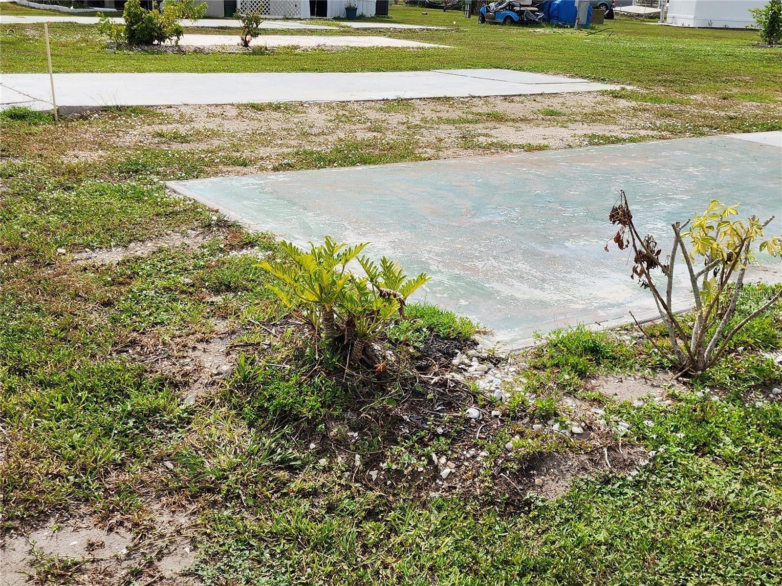 NEW 200 AMP MAIN BREAKER METER PANEL AND TREATED POST HAVE BEEN INSTALLED AND APPROVED BY CHARLOTTE COUNTY. This CLEARED LOT is configured to accommodate a DOUBLE WIDE WITH AN ATTACHED CARPORT. Conveniently located on the first street within the community - and only a few lots down the street from the TWO LARGE POOLS & RECREATION CENTER. This property also affords you a view of the lake across the street. In addition, the neighbors are friendly and will welcome you to the park right away. Tucked away - yet close to everything - VHL is a wonderful, GULF ACCESS community with a BOAT RAMP, fishing pier, and boat slips. GROUNDS MAINTENANCE is included in the low monthly fee. Here you can be as social as you'd like with its many activities such has horseshoe tournaments, block parties, woodworking, billiards, pot luck dinners, and so much more! Both full-time residents and snowbirds love to call Village of Holiday Lake home. Come check it out for yourself today.