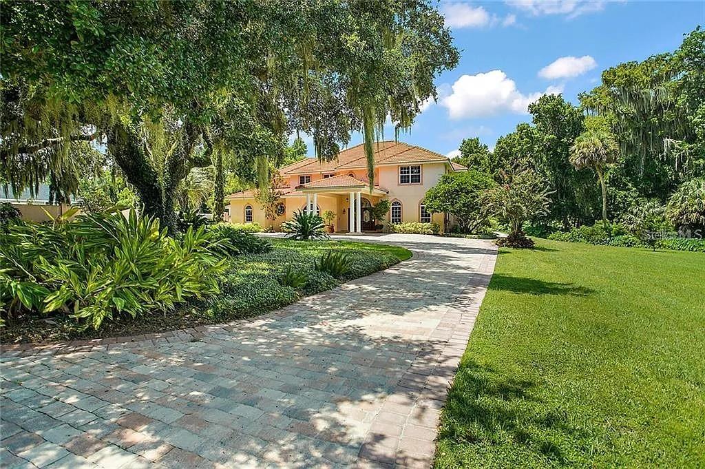 Stunning Custom-Built Waterfront Estate in Gated Majestic Oak Shores
Welcome to this breathtaking custom home situated on 1.5 acres of canal-front property in the exclusive Majestic Oak Shores community. Perfectly designed to enjoy the Harris Chain of Lakes lifestyle, this home blends elegance, comfort, and endless entertainment opportunities.
Step through the porte-cochere entry into a grand foyer that opens to the formal living and dining rooms, where beautiful tile flooring flows throughout the first floor. The spacious family room boasts soaring 20-foot ceilings, a cozy gas fireplace, and French doors leading out to the sparkling pool and spa.
The chef’s kitchen is an entertainer’s dream, featuring granite countertops, a large center island, wet bar, trey ceiling, and abundant cabinetry. A versatile first-floor bonus room offers the perfect space for a home office, gym, or potential in-law suite. The luxurious master suite is a retreat of its own, complete with dual walk-in closets, a private study, and a spa-inspired bathroom with garden tub and separate shower.
Upstairs, you’ll find four oversized bedrooms and a loft/game room ideal for family gatherings.
The outdoor living spaces are just as impressive—enjoy a covered patio with gas hookup for a summer kitchen, a resort-style pool and spa, private covered boat dock with lift, basketball/tennis court, and a lake-fed irrigation system. Parking is a breeze with an oversized 2-car garage plus a 2-car carport.
Located just minutes from UF Health Hospital, Venetian Gardens Park & Ski Beach, Lake Harris boat ramps, and historic downtown Leesburg, this home truly has it all.
? Don’t miss your chance to own this one-of-a-kind estate—schedule your private tour today!