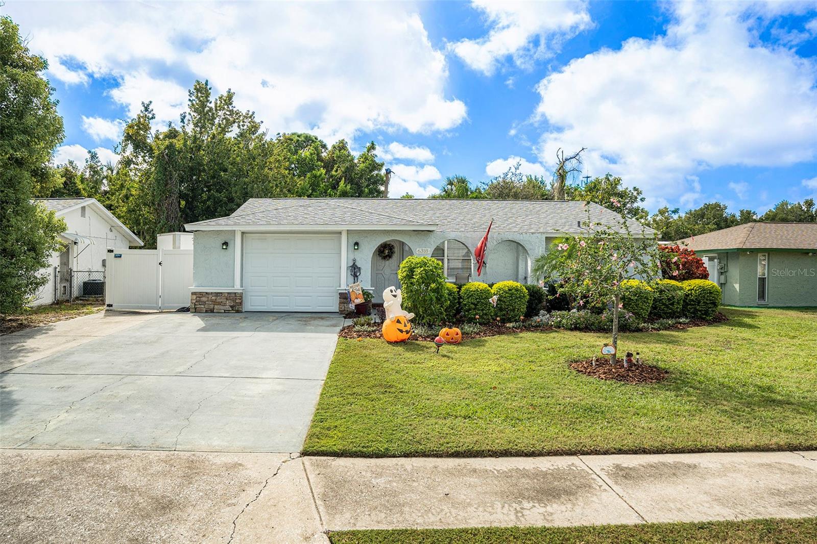Welcome home to your own slice of paradise in New Port Richey! This beautifully updated 3-bedroom, 2-bath home combines modern comfort, peace of mind, and the freedom of no HOA, no CDD, and no flood zone. From the moment you arrive, you’ll fall in love with its inviting curb appeal. Step inside to discover a bright, open floor plan that flows easily from the living room to the dining and kitchen areas — perfect for relaxing, entertaining, or family gatherings. The home features vinyl flooring throughout the main living spaces, with tile in the wet areas for durability and style. The updated kitchen is a true highlight, offering brand-new stainless steel appliances, sleek finishes, and plenty of cabinet space to make cooking a joy. Every detail has been thoughtfully updated for comfort and convenience, including a newer roof (2021), AC (2016), updated plumbing, electrical, and doors (2016), and new soffits (2022). Fresh interior paint, crown molding, and 5¼-inch baseboards add a warm, polished touch throughout. Step outside to your private backyard retreat — fully fenced and surrounded by lush landscaping, perfect for weekend barbecues, morning coffee, or simply enjoying the sunshine. Located close to shopping, dining, parks, and the gorgeous Gulf beaches, this move-in-ready home perfectly blends comfort and convenience. Whether you’re a first-time buyer, downsizing, or searching for a low-maintenance Florida retreat, you’ll love the modern upgrades, spacious layout, and peaceful setting. Enjoy everyday living with nearby amenities, outdoor recreation, and some of the best sunsets on the Gulf Coast just minutes away. This New Port Richey gem truly checks all the boxes for value, style, and easy Florida living, so don’t wait—schedule your private showing today and make it yours!