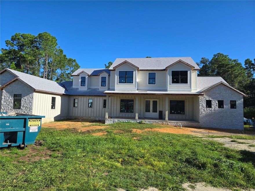 Pre-Construction. To be built. The pictures are renderings of the home being built. Located in Blue Spring Reserve a gated community of upscale homes.  Excellent location right down the street from the Fl turnpike and Hwy 27 for easy commutes. The lot is roughly 1.2 acres with woodlands and wetlands in the rear. Very peaceful environment. Features include Owners suite first floor, Guest suite first floor, Second floor loft, Second floor game room above garage, Laundry rooms on both first and second floor, Custom kitchen with solid plywood cabinets, High efficiency A/C systems, High efficiency water heater, Spray foam insulation, Double pane windows, Decorative insulated garage doors, Electric fireplace in great room, crown molding and much more! And....there's still time to add some upgrades and pick colors. Plenty of room to add an in ground pool.