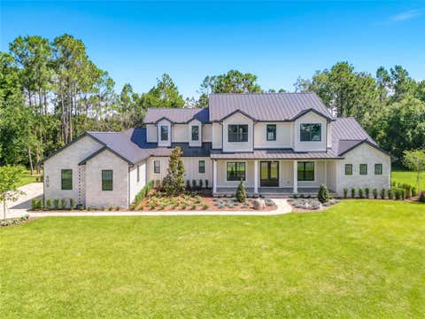 Photo of 405 Long And Winding Road, Howey In The Hills, FL 34737 (MLS # O6245797)