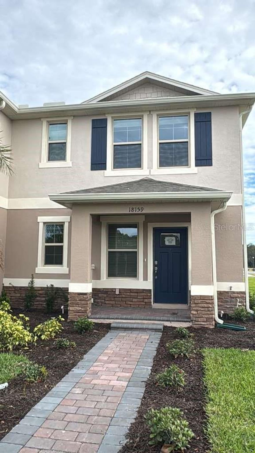 Welcome to this charming Sandhill townhome in the highly desirable Waterleigh community. Offering 3 bedrooms, 2.5 baths, 1,816 sq ft, a one-car garage, and a versatile loft, this home blends comfort and functionality with modern style. The open-concept layout features a bright living area, a well-appointed kitchen with quartz countertops, stainless steel appliances, and island seating, plus a convenient first-floor powder room and covered rear porch. Upstairs, the spacious primary suite includes a walk-in closet and ensuite bath, while the loft provides flexible space for a home office or lounge area. Smart home features enhance everyday living, all within a resort-style community close to shopping, dining, and major roadways.