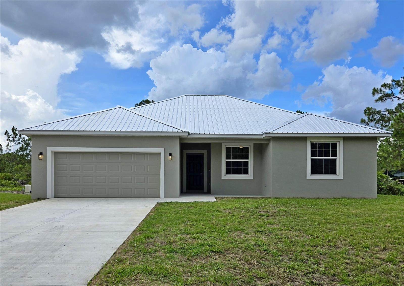 Welcome to this newly constructed 3-bedroom, 2-bathroom home in Avon Park, offering a perfect balance of privacy and convenience. Located just off the beaten path, yet minutes from shopping, dining, and essential amenities, this home provides the serenity of a quiet setting without sacrificing accessibility.Inside, you'll find luxury vinyl plank flooring throughout, combining durability with stylish appeal. The open floor plan creates a seamless flow, making entertaining and everyday living effortless. The kitchen is thoughtfully designed with custom cabinetry featuring elegant crown molding, offering both functionality and sophisticated craftsmanship. 5 1/4-inch baseboards add a polished finish to the space, enhancing its modern aesthetic.Positioned in a desirable location near scenic parks, golf courses, and major highways, this home is ideal for those seeking a tranquil retreat with unmatched value. And with a price below the competition, you truly get more for less.Don’t miss out on this incredible opportunity—schedule your private tour today!