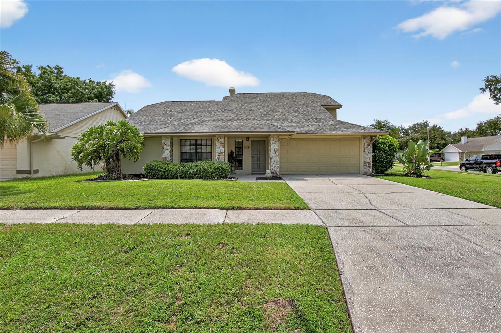 Welcome to your dream home in Providence Lakes! This beautiful 4-bedroom, 2.5-bathroom residence sits on an oversized 0.21-acre corner lot on a quiet cul-de-sac road and offers modern updates including a NEW ROOF in 2023, a NEW A/C unit in 2024 (14 seer), and freshly painted exterior in 2024. Located in a community with LOW HOA fees and NO CDD, this home provides outstanding value and peace of mind. Inside, you'll find a thoughtfully designed layout with the primary suite conveniently located downstairs, featuring two walk-in closets and a spacious en-suite bathroom. Upstairs are three additional generously sized bedrooms—two with walk-in closets—and rich hardwood flooring throughout. The large living room centers around a cozy wood-burning fireplace and is complemented by a second family room, a formal dining room, and a bright eat-in kitchen. The private backyard oasis is perfect for relaxing or entertaining, complete with a sparkling pool and spa, a covered lanai, and ample space for a swing set, trampoline, or outdoor play area. Providence Lakes is ideally situated in the heart of Brandon, with easy access to I-75, the Crosstown Expressway, downtown Tampa, MacDill AFB, and a wide array of restaurants and shops. The community also features a playground and miles of sidewalks perfect for long walks. This home blends comfort, updates, and location—schedule your private showing today!