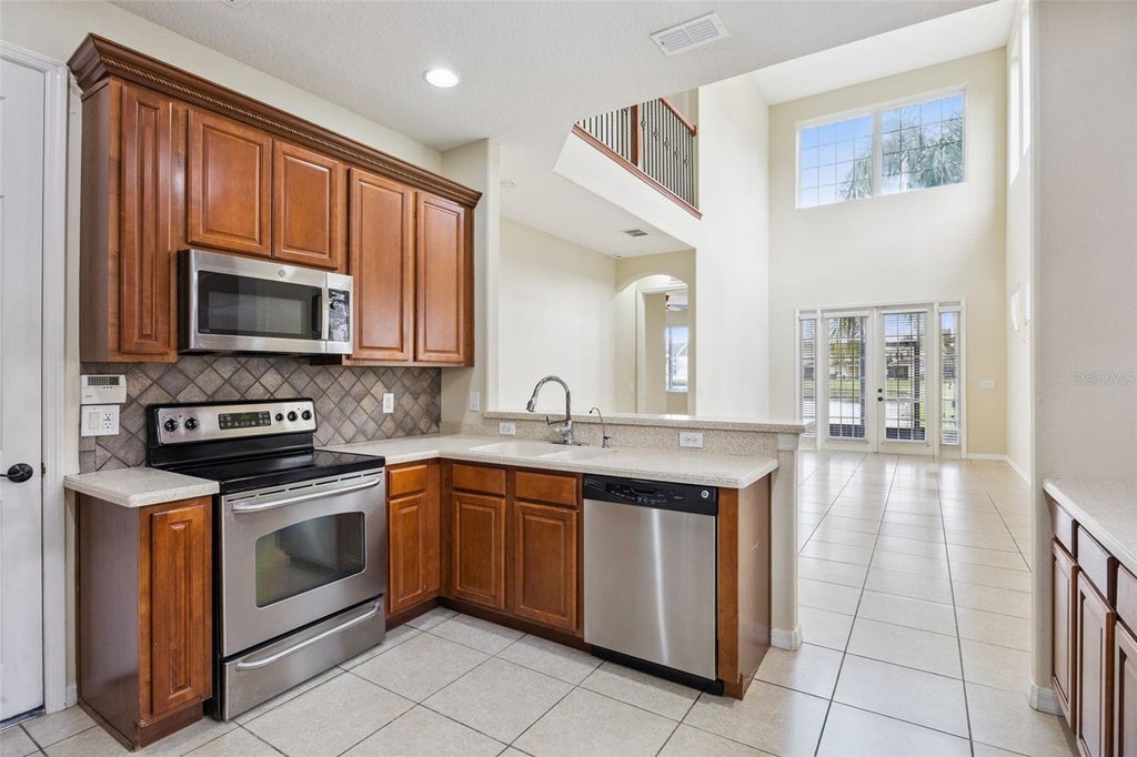 Photo of 551 Terrace Spring Drive, Orlando, FL 32828 (MLS # O6418210)