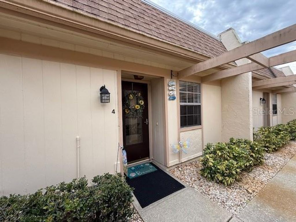 Photo of 11140 Carriage Hill Drive #4, Port Richey, FL 34668 (MLS # TB8466110)