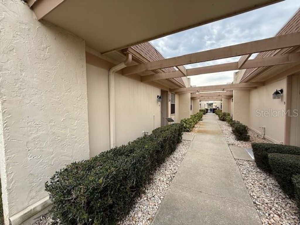 Photo of 11140 Carriage Hill Drive #4, Port Richey, FL 34668 (MLS # TB8466110)