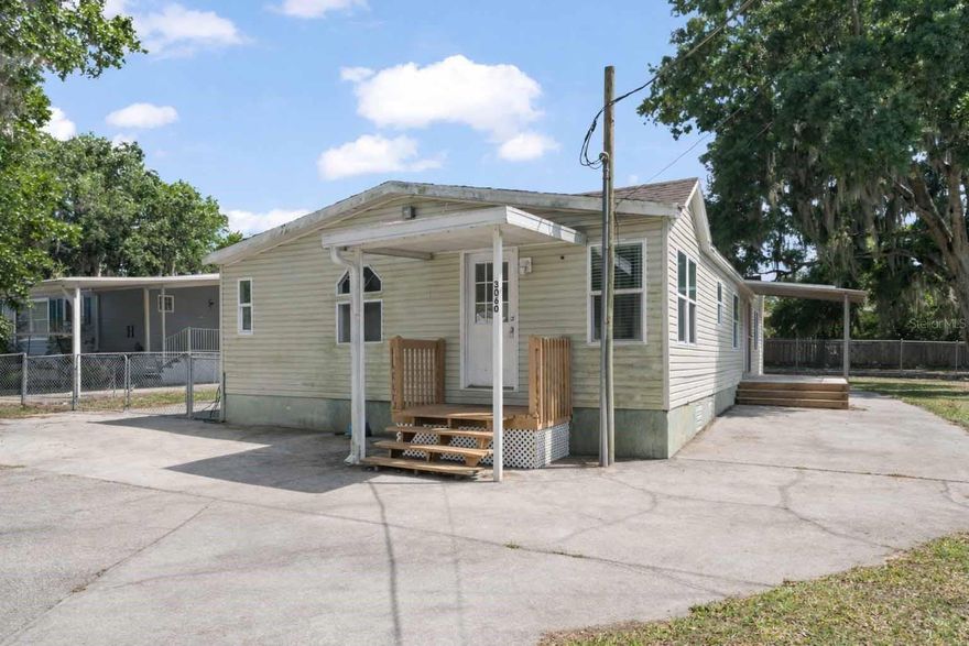 This 3 bedroom/2 bath home offers 1,404 sq. ft. of living space on a spacious 0.28-acre canal-front lot with access to a private lake. Inside, you'll find a functional layout featuring a kitchen with wood cabinetry and stainless steel appliances, a cozy living area with a wood-burning fireplace, and bedrooms with double-door closets. The primary bath includes dual vanities, tile flooring, and a dedicated laundry area for added convenience.

Enjoy outdoor living with a fenced yard, a designated car parking area, and plenty of room for future upgrades or entertaining. The property also includes a storage shed for added convenience and a small private fixed dock, perfect for enjoying the waterfront setting. Recent updates include a roof approximately 2?3 years old and a central A/C system installed in 2019. Conveniently located near major highways, shopping, dining, and local attractions, this property offers comfort, space, and a desirable waterfront lifestyle.