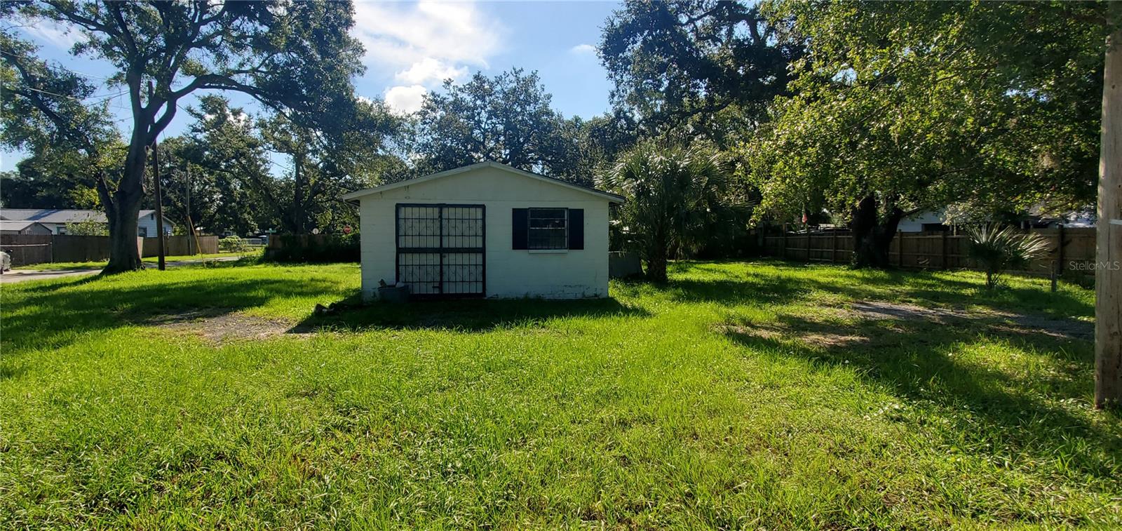 This home offers a 10,300 sq ft lot. The Two Lots are completely separate so You can put an additional home on the second lot. The home has to be finished inside. The area is up and coming. Convenient to schools, the Highway and shopping. MOTIVATED SELLER