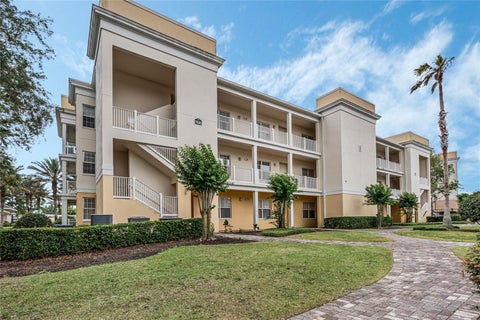 Photo of 7505 Mourning Dove Circle #303, Reunion, FL 34747 (MLS # O6430477)