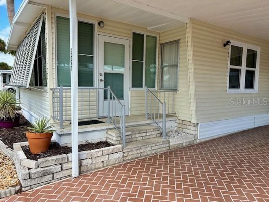 This light and spacious 2/2 Mobile is located in the much sought after Japanese Gardens MHP. This home has nice curb appeal and recently had roof, and gutters checked and updated. The home has an enclosed prorch area in the front of home that can be used as a sitting room, den/office space or a third bedroom if needed. The ectra large living / dining area has a lot of light with the new vinyl windows The dining area has built in cabinets  for storage and/or dishes and decor display. The dining area opens to the spacious kitchen with newer appliances and 2 pantries. The guest room has ample closet space and has a walk through to the guest bath. The bath has tub/shower combo and tile flooring.
The  Master bedroom has built in dresser on one end and the ensuite bath and walk in closet on the other. The master bath is tiled and has walk in shower. The washer and dryer are located in the large shed attached to the home and the screened lanai under the carport. This home is being sold as is and is in need of updating and some repair on the inside. The carpet has been ripped up to expose a clean slate for you to choose the type of flooring you wish to have in your home. The front room is in need of some wall and trim repair. The bathrooms and Kitchen areas could use cabinet/counter updating or paint. the roof is good and the home has new windows. The community has sidewalks and wider roads for a Mobile community. there is a large heated pool and hot tub. The community building has planned activities  and library and billiards. Your low HOA also includes pickleball, shuffleboard, horse shoes, bocce ball. Your monthly fee includes water, sewer, cable,pest control, trash,streetlights and park maintenance. Beautiful community with all amenities for the low price of $256 a month. If you are a DIY person and would love a great deal to put your style stamp on, shcedule your showing today and start living that SW Florida Lifestyle!