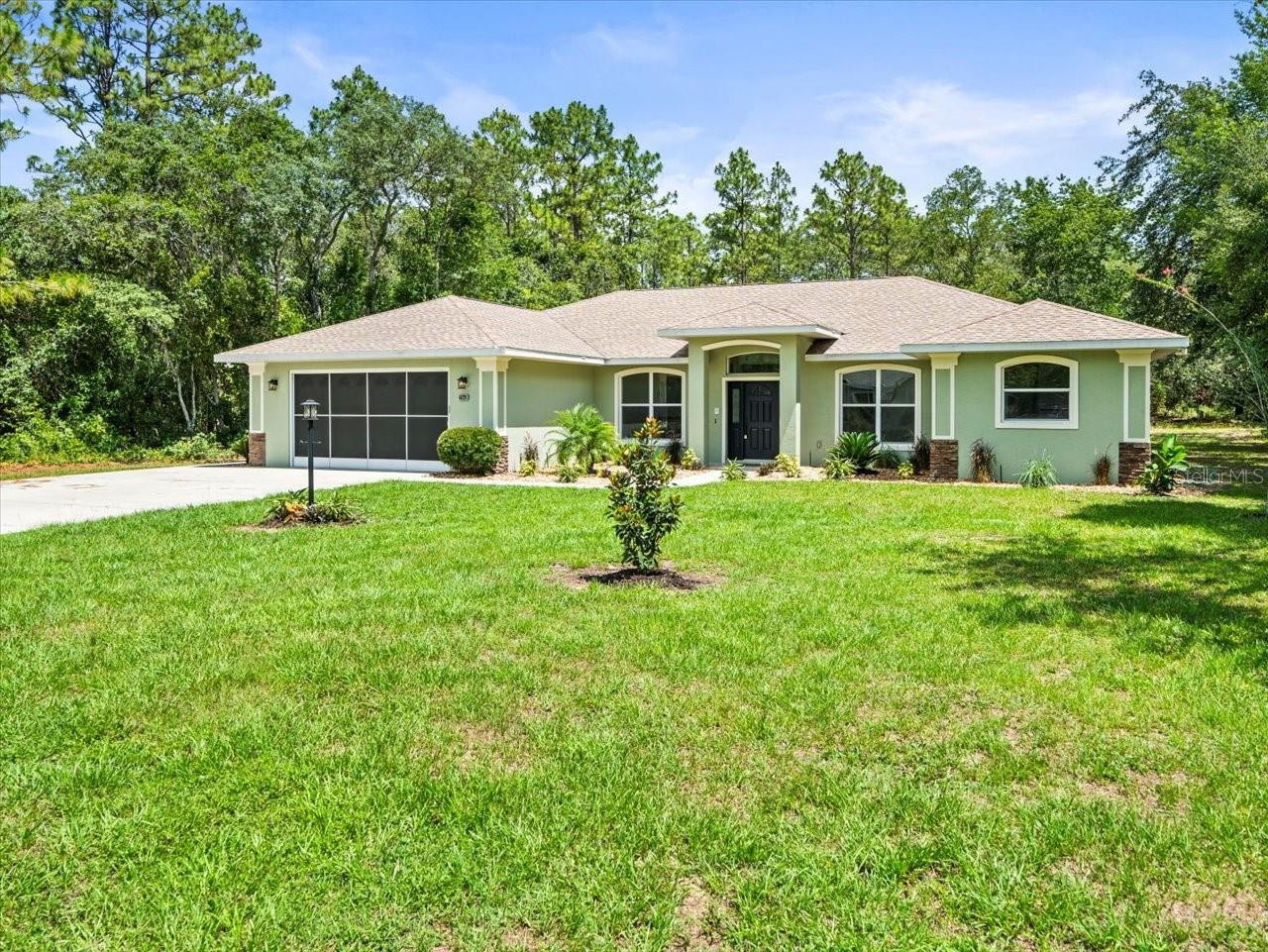 ***Price Improvement*** Luxury Remodeled by Burris RSTD. This 4 Bedroom, 3 Full Bathroom Pool Split Floor Plan Home
with High-End Upgrades on a half-acre lot offers 2,724 sq ft of living space. Built in 2008 and
recently renovated throughout, this home combines solid construction with luxury finishes.
Step into a fully updated kitchen and baths featuring quartz countertops, new vinyl flooring
throughout, freshly painted interior and new lighting including fans. The kitchen inspires you to
become the party host by providing you plenty of room with all brand-new appliances including
oven/microwave combo, cooktop, hood, fridge, and dishwasher. Luxury is awaiting its new
owner as the primary suite that includes a 12' double rainfall walk-in shower with doorless
entry a true spa-like retreat. The other two baths were given the same quality of upgrades
featuring tiled showers, quartz countertops, and new toilets with updated cabinetry. Additional
amenities are gas powered Generac generator, Bluetooth-enabled intercom system, fresh
landscaping and painted garage and lanai. The new lanai ceiling fans within the screened-in
pool enclosure provides you with privacy to enjoy your Florida oasis. This move-in-ready home
offers comfort, style, and peace of mind in a desirable location.