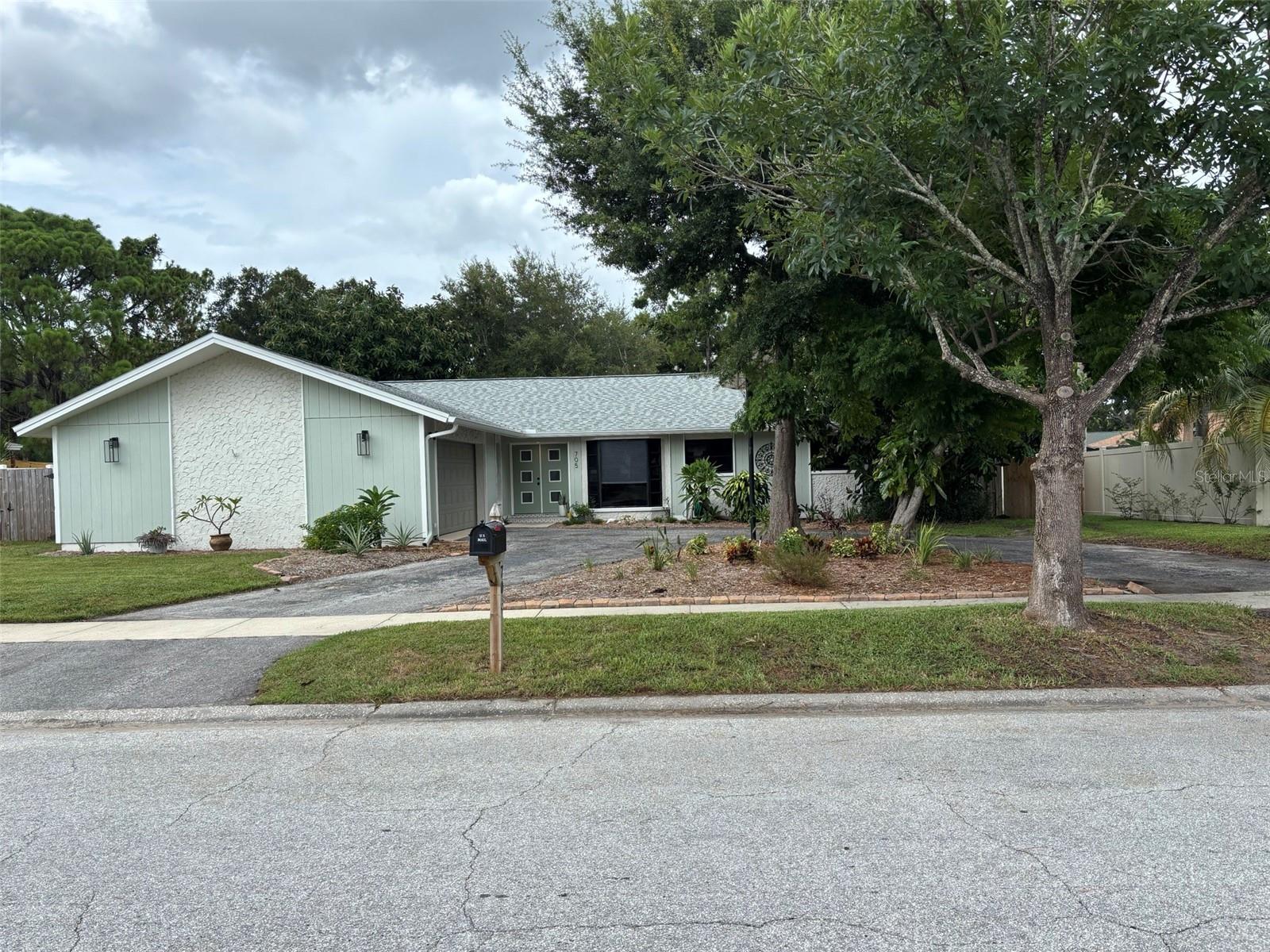Welcome to 705 Wild Oak Lane and West Lake Village, a premier home in a premier community. This is not your grandma's dated boxy house. This home has been recently updated with a new roof, new kitchen with shaker cabinets, quartz counter tops, stainless steel appliances. Both bathrooms are beautifully updated with solid wood shaker cabinets, quartz counter tops and new tile surrounds. Wide open main living area with souring ceilings and a bar area, perfect for entertaining. One of the few floor plans in Westlake Village where you can sit on the couch, see out the front window, watch your big screen tv and look out the HUGE sliding glass doors into your tropically lush, fenced back yard. No "boxy" feel here. There is a large screened in patio with your second family room and second dining table, for those awesome winter months, here in Florida.
There is a bar top between the kitchen and great room. Master Bedroom has more than enough room for a California King sized bed, furniture and even a small couch, if you would like. Master closet is large enough to get lost. I would bet this is the largest master closet in the community. Mst bathroom has been tastefully remolded into a spa like feeling. This home has a nice size, interior, laundry room and last but not least, you have a huge double car garage with a separate area for your work bench and sink.
Westlake village has a huge central park area, with walking trails, pickle ball courts, tennis courts, basketball courts, huge pool, club house, and fun playgrounds for the little ones. If you hate trees, don't even bother coming to this community. It has tons of beautiful, mature shade trees.
Bedroom 4 in this home is in the center of the house, with makes it a non-conforming bedroom, but it was used by the last owners for a nursery.
Listing agent has a vested interest in the property.